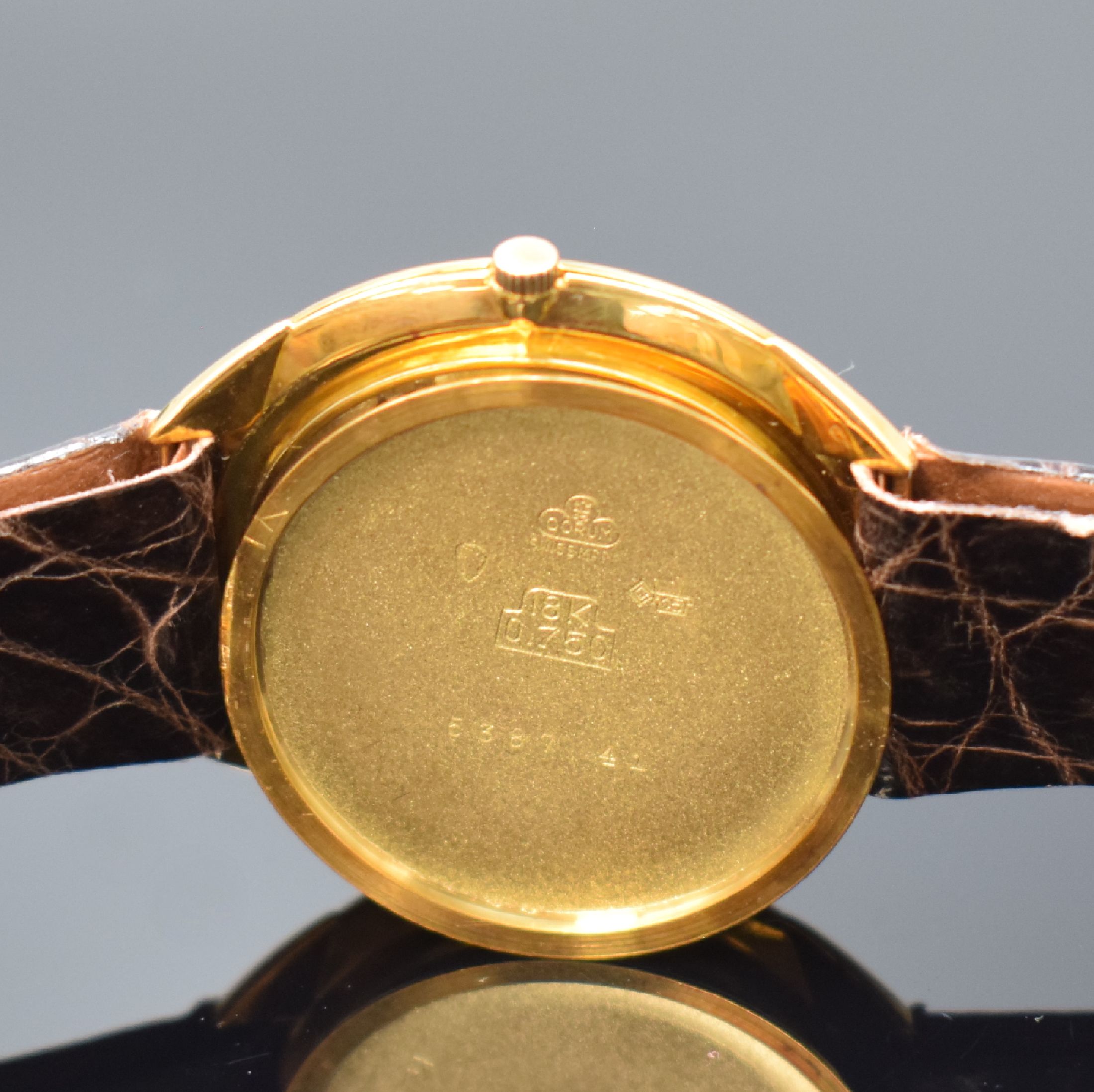 Detail e: CORUM Armbanduhr in GG 750/000, Schweiz um 1960, Handaufzug, 3-tlg. Geh., Boden u. Glasrand aufgedr., silb. Zifferbl. rest., gold. Indizes u. Zeiger, ...