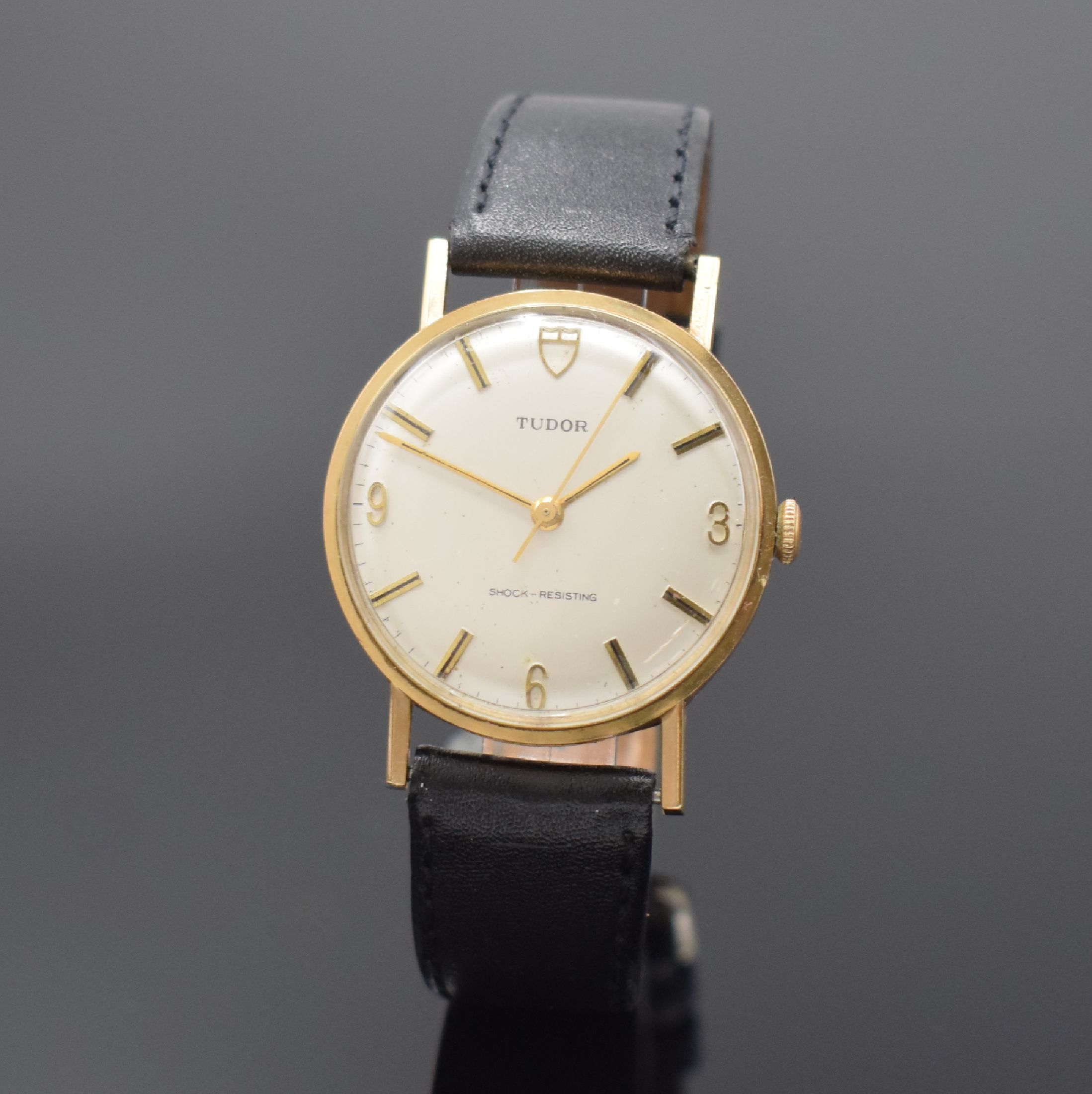 TUDOR Herrenarmbanduhr in GG 375/000, Schweiz f. den engl. Markt um 1960, Handaufzug, neutr. Geh., Boden aufgedr. (dell.), silb. Zifferbl. m. gold. ...