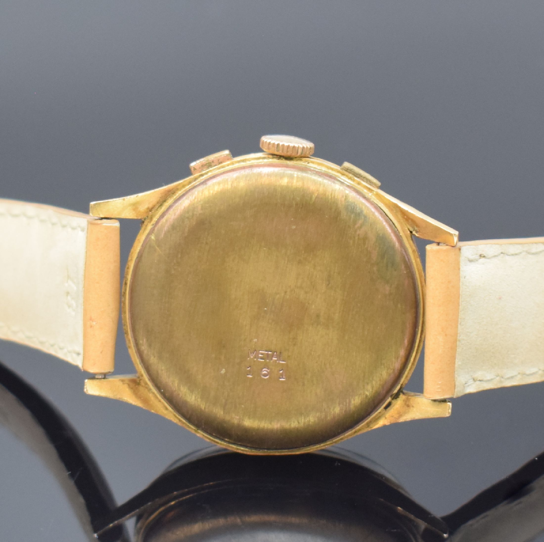 Detail d: CELEBRA Armbandchronograph in GG 750/000, Schweiz um 1950, Handaufzug, Boden aufgedr., silb. Zifferbl. m. gold. Std.-Ind., gold. Zeiger, 30 ...