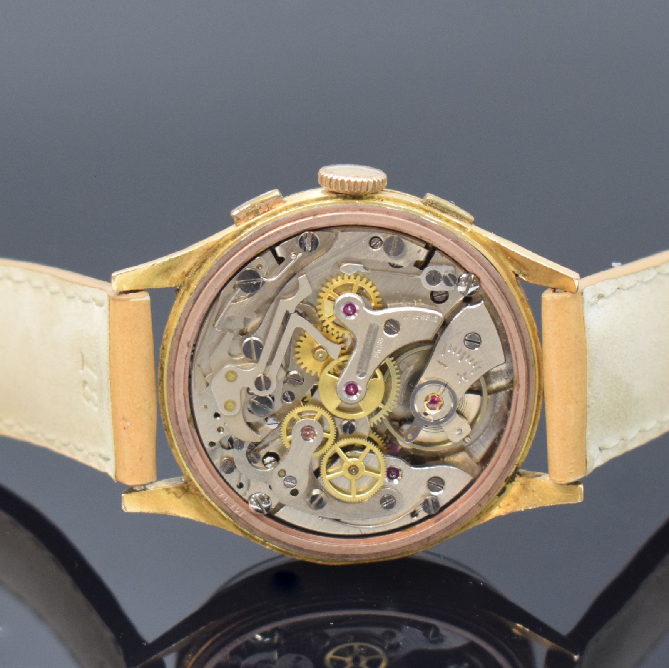 Detail e: CELEBRA Armbandchronograph in GG 750/000, Schweiz um 1950, Handaufzug, Boden aufgedr., silb. Zifferbl. m. gold. Std.-Ind., gold. Zeiger, 30 ...