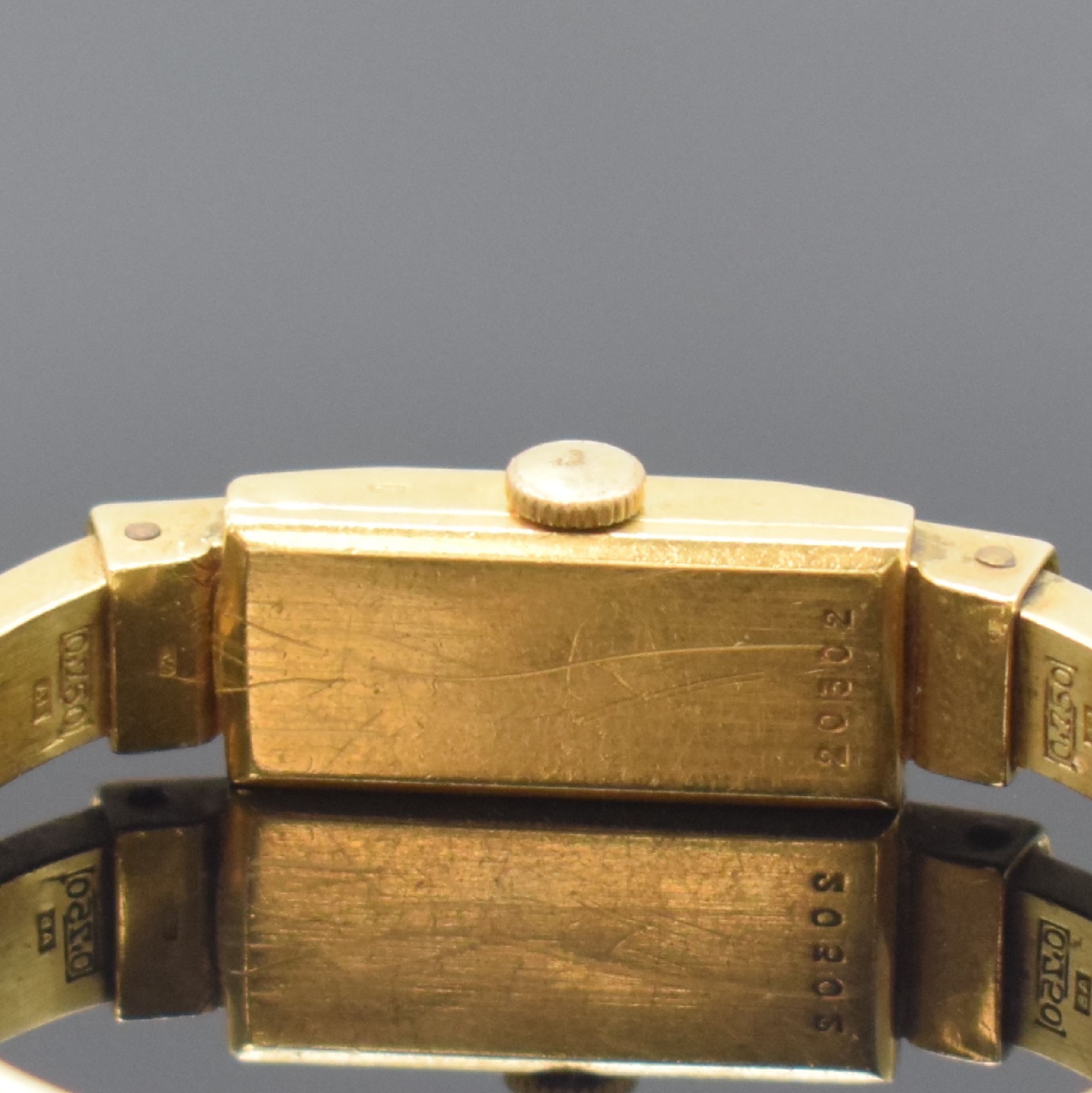 Detail d: BAUME & MERCIER Spangenuhr in GG 750/000, Schweiz um 1940, Handaufzug, Boden aufgedr., silb. Zifferbl. altersbed. pat./fl., gold. Std.-Ind. u. ...