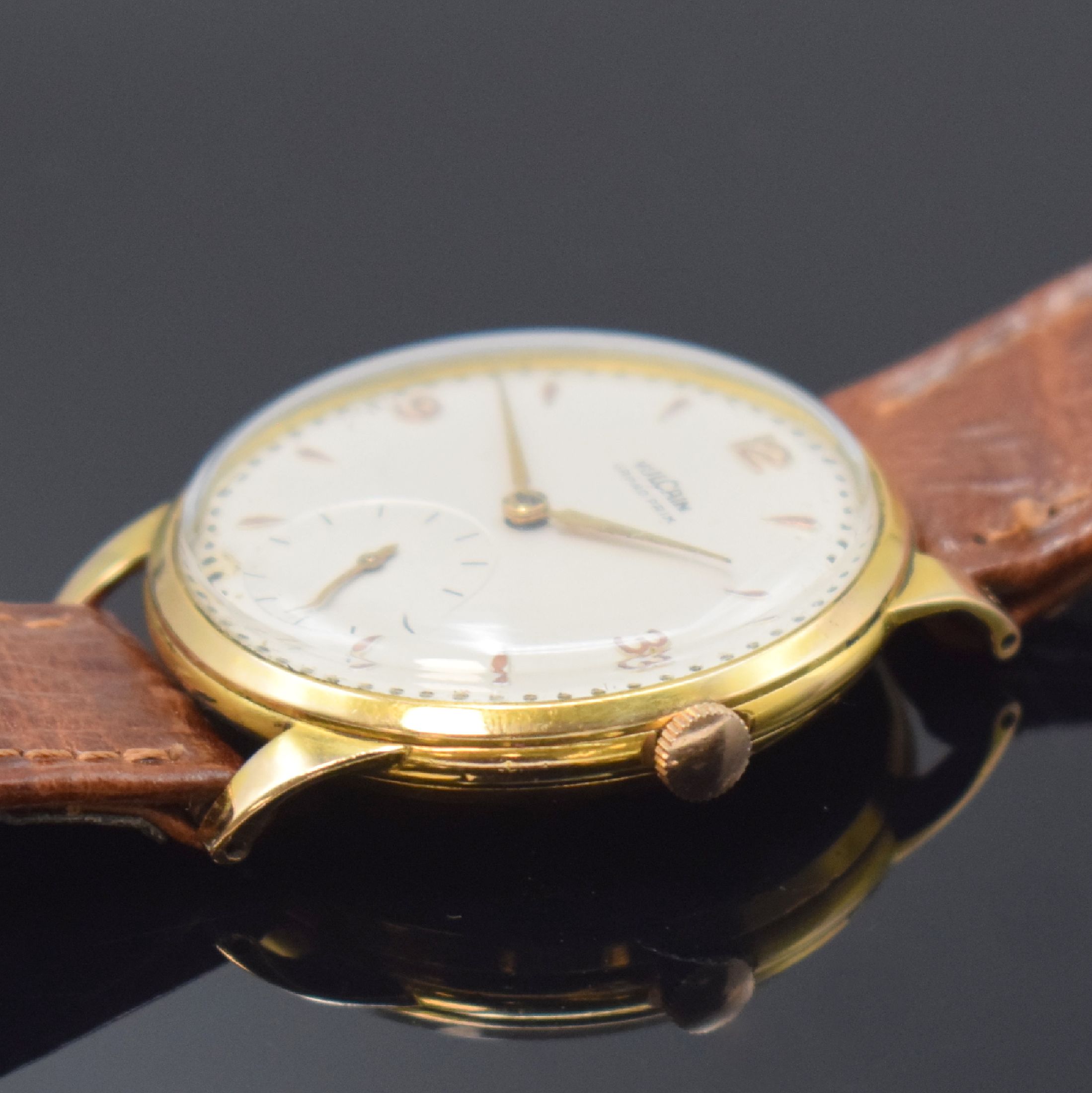 Detail b: VULCAIN Herrenarmbanduhr in GG 750/000, Schweiz um 1945, Handaufzug, 3-tlg. Geh., Boden u. Glasrand aufgedr., silb. Zifferbl. rest., kl. Sek. b. 6, ...