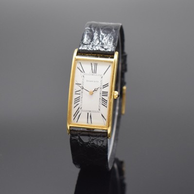 TIFFANY & CO Armbanduhr in GG 750/000, Schweiz um 1975, quarz, Boden aufgedr., Schmuckkrone, weißes Zifferbl. m. röm. Zahlen, schwarze Zeiger, M. ...