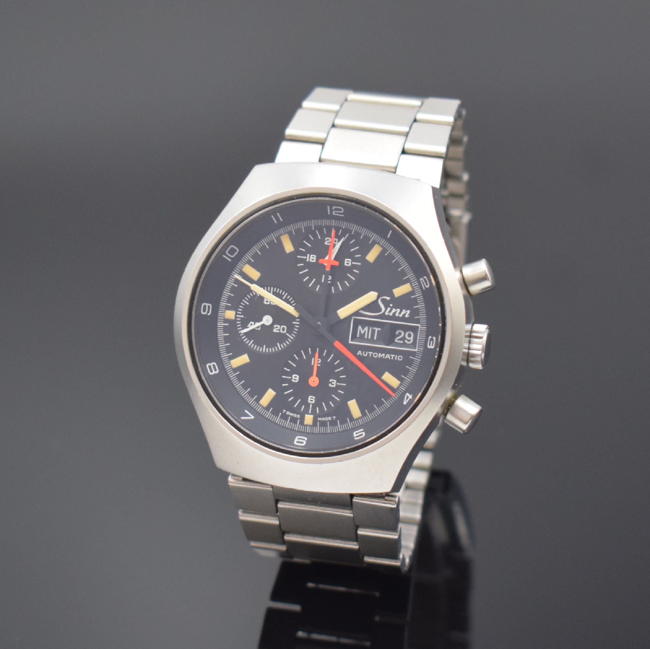 SINN Herrenarmbanduhr mit Chronograph, Schweiz/Deutschland um 1990, Automatik, verschr. Edelstahlgeh., unsign. Gliederband m. Faltschl., schwarzes ...