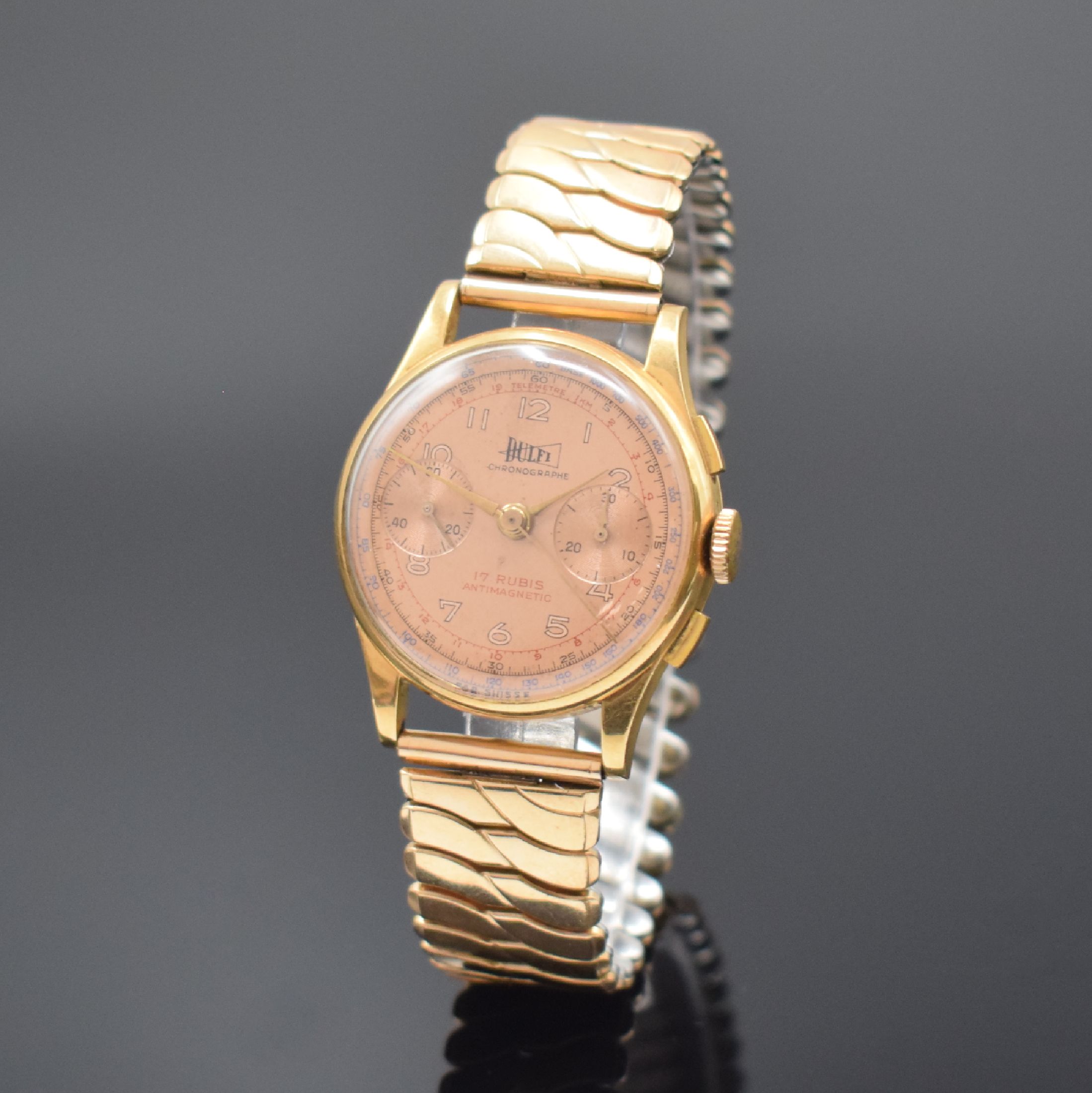 DULFI Chronographe Herrenarmbanduhr in RG 750/000, Schweiz um 1950, Handaufzug, 3- teil. Geh., Boden u. Glasrand aufgedr., kupferfarb. Zifferbl. m. ...
