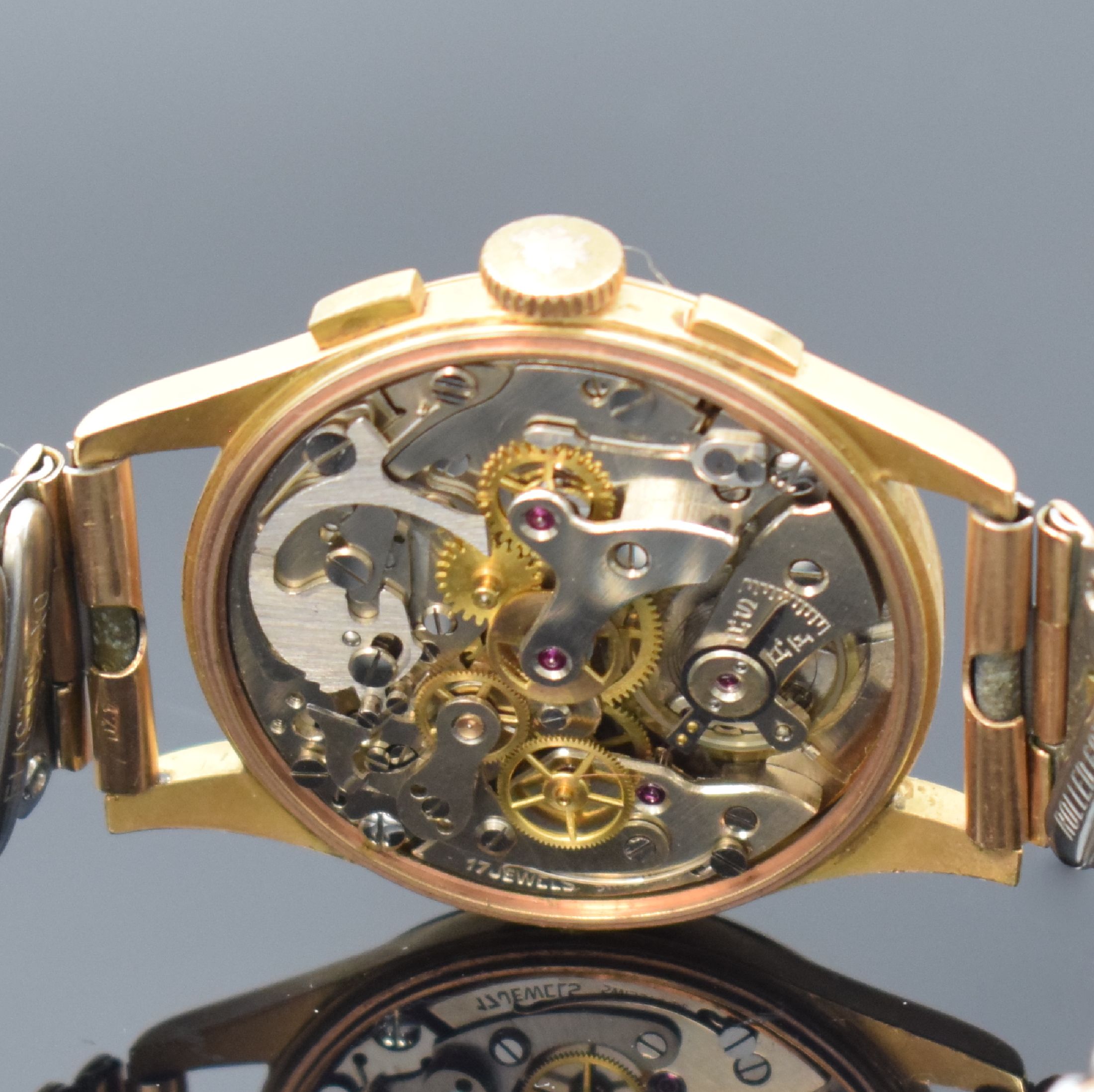 Detail e: DULFI Chronographe Herrenarmbanduhr in RG 750/000, Schweiz um 1950, Handaufzug, 3- teil. Geh., Boden u. Glasrand aufgedr., kupferfarb. Zifferbl. m. ...