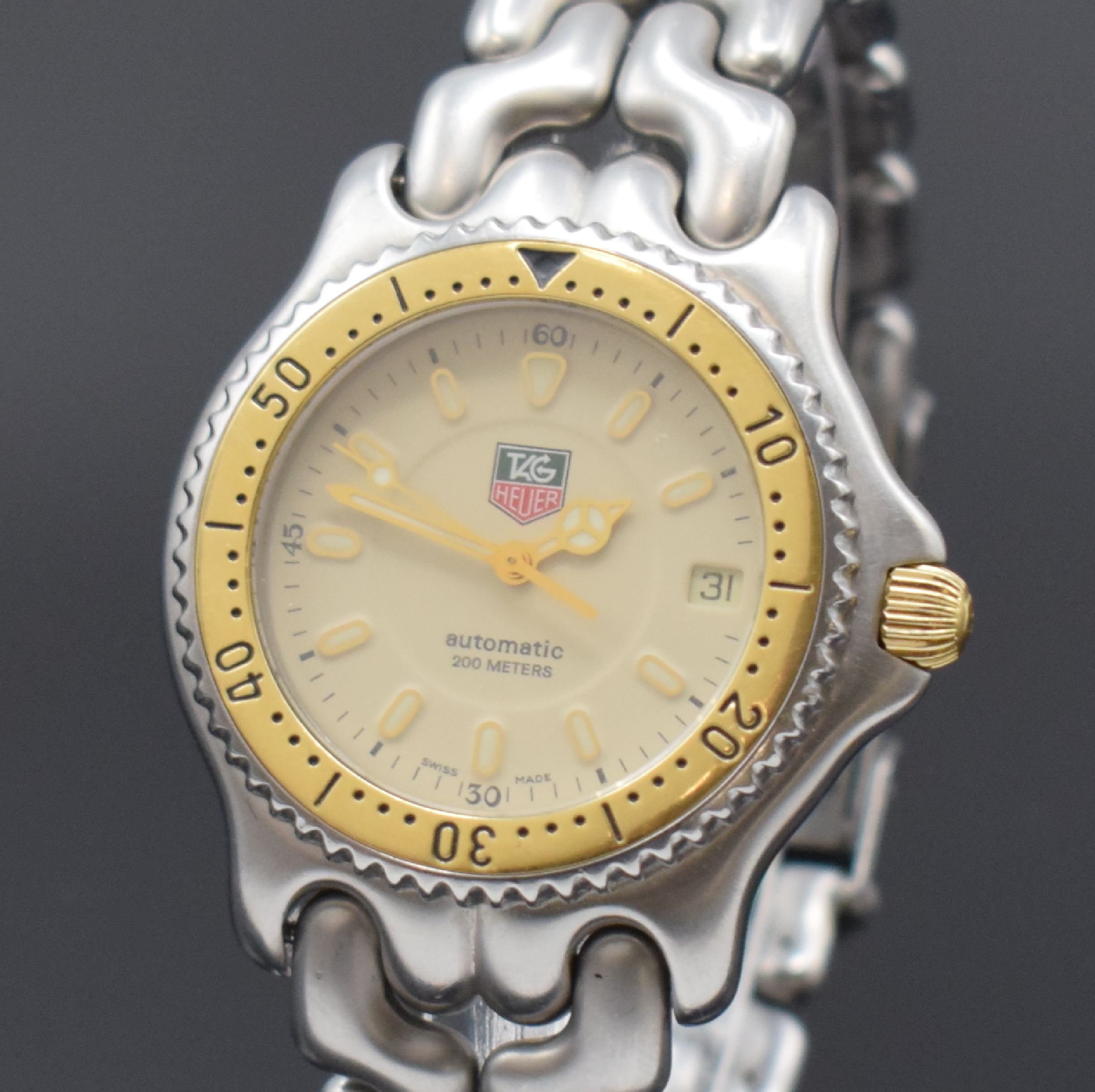 Detail a: TAG HEUER Armbanduhr Referenz S 87.006 E in Stahl/Gold, Schweiz um 1995, Automatik, orig. Stahlband m. Faltschl., Boden u. Krone verschr., Lünette ...
