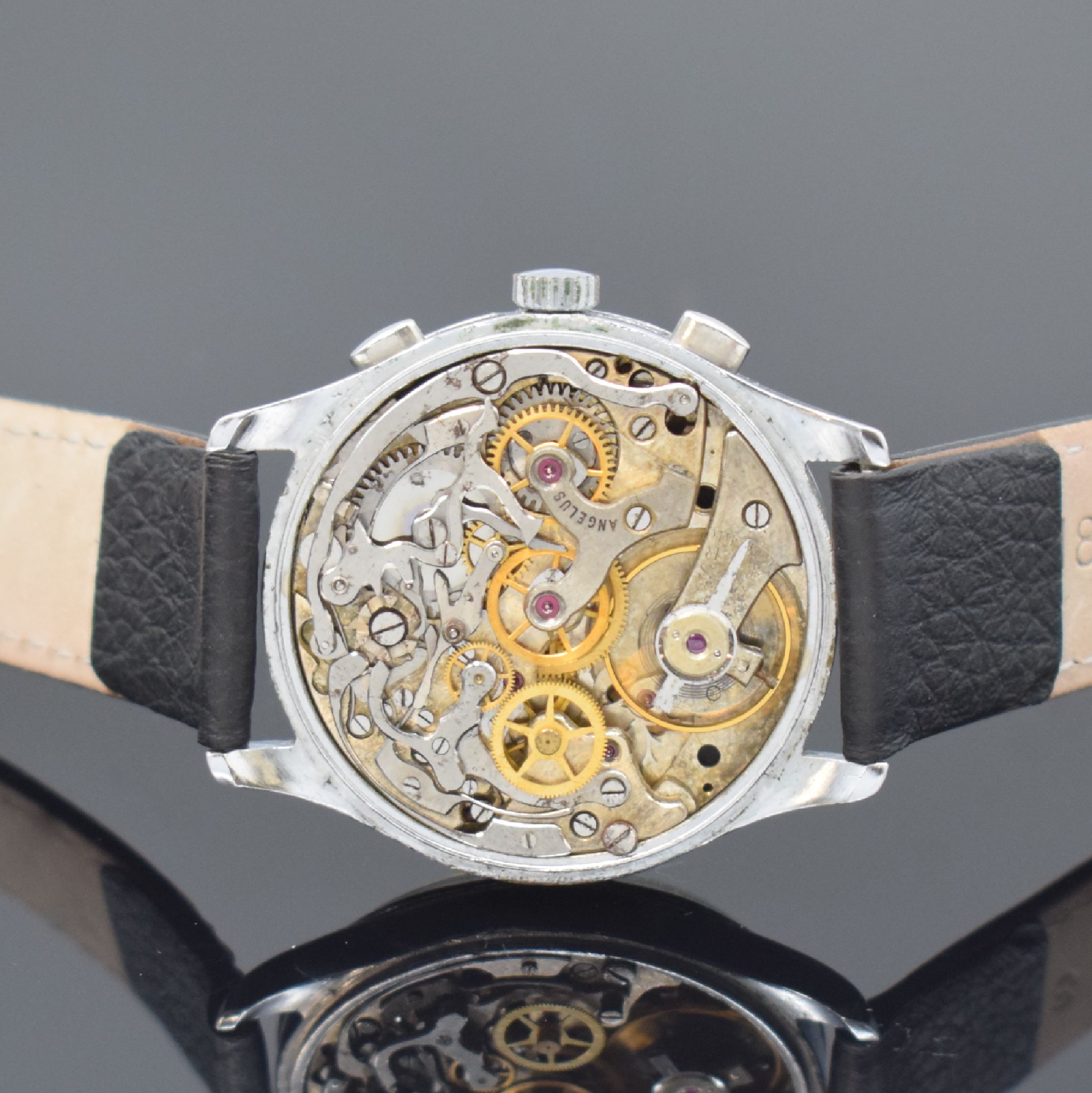 Detail d: ANGELUS Herrenarmbanduhr mit Chronograph Kaliber 215, Schweiz um 1945, Handaufzug, 3 -teil. verchr. Gehäuse, Stahlboden aufgedr., orig. Zifferbl., ...