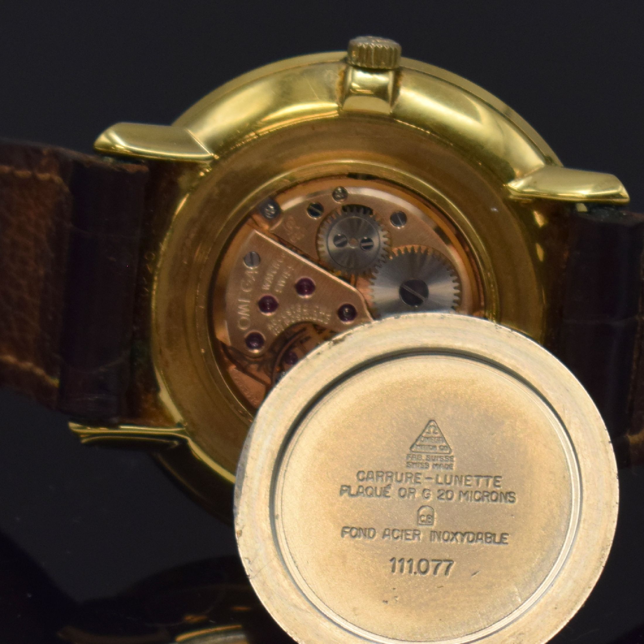 Detail f: OMEGA De Ville vergoldete Armbanduhr Referenz 111.077, Schweiz um 1968, Handaufzug, orig. Lederband (zu ers.) m. verg. Schl., champagnerfarb. ...