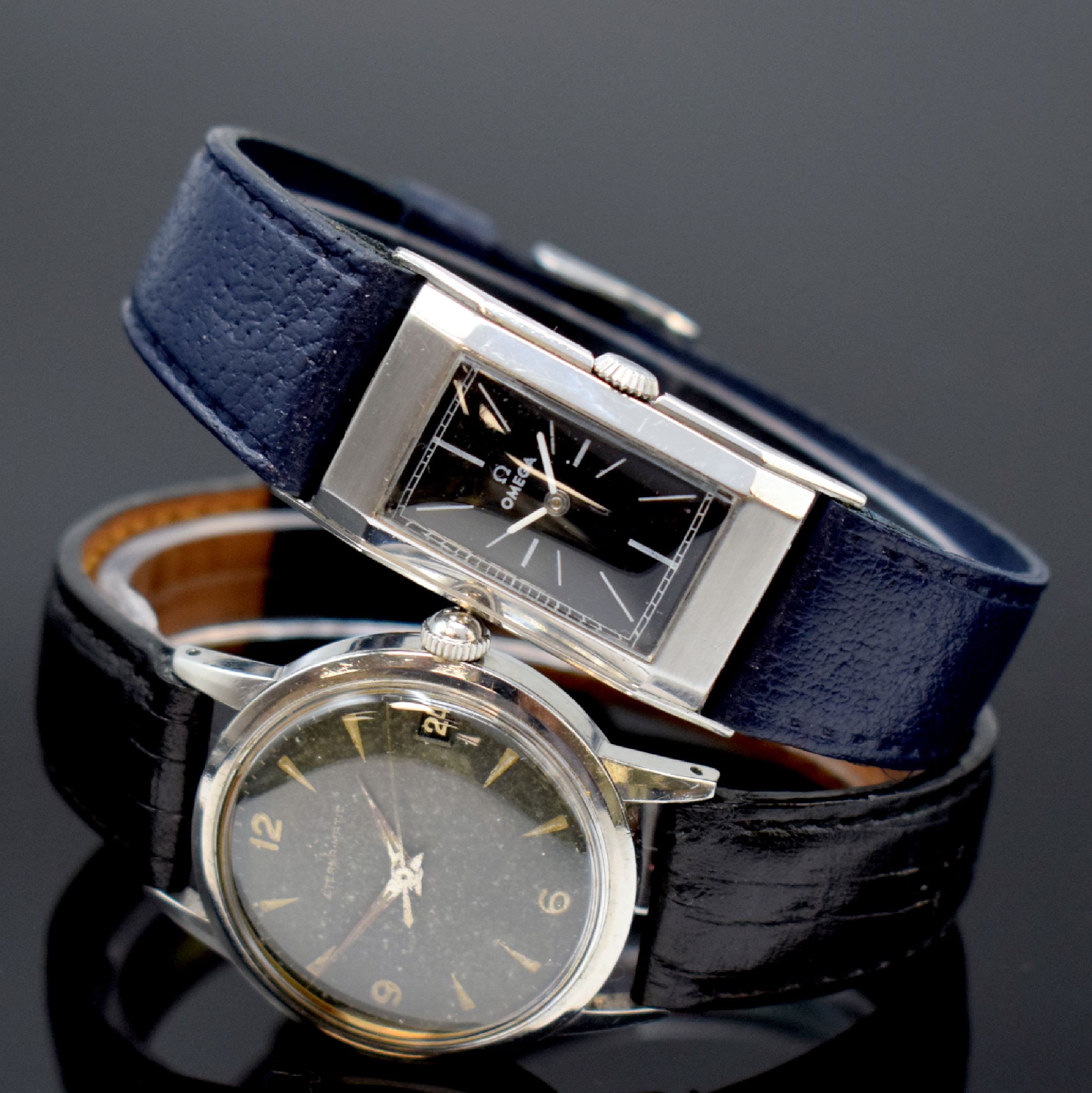 OMEGA / ETERNA 2 Armbanduhren in Stahl, Schweiz um 1935 / 1955, Handaufzug / Automatik, 1.) rechteck. OMEGA, gedr. Geh., schwarz. Zifferbl. rest., ...