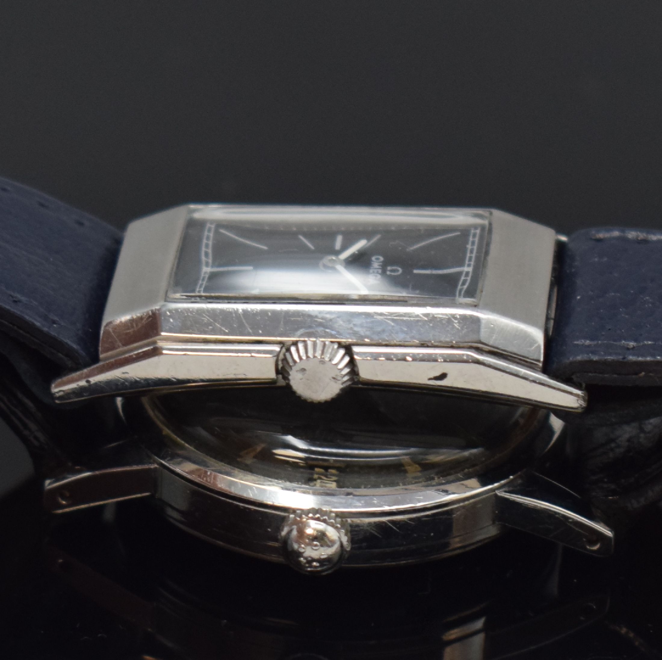 Detail b: OMEGA / ETERNA 2 Armbanduhren in Stahl, Schweiz um 1935 / 1955, Handaufzug / Automatik, 1.) rechteck. OMEGA, gedr. Geh., schwarz. Zifferbl. rest., ...