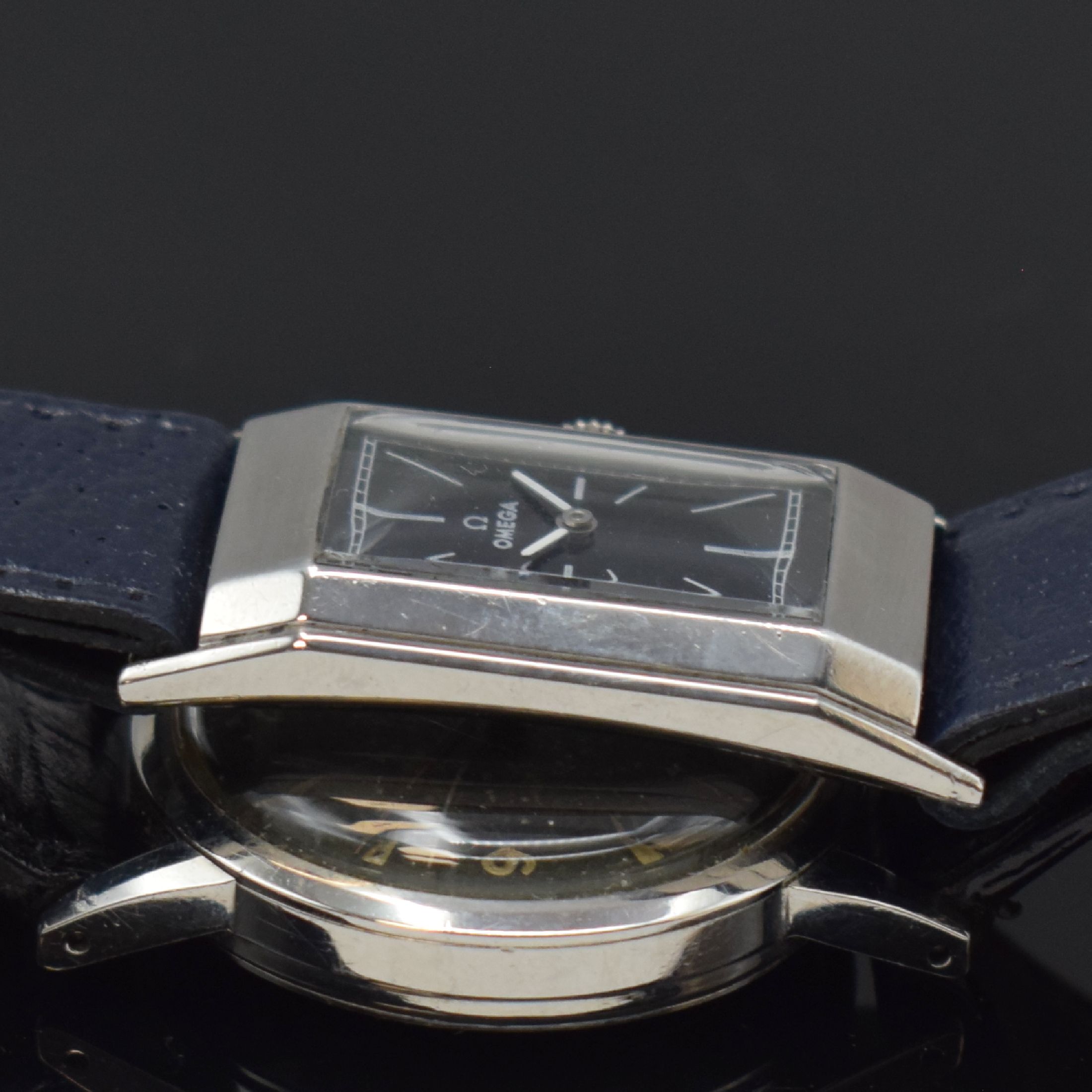 Detail c: OMEGA / ETERNA 2 Armbanduhren in Stahl, Schweiz um 1935 / 1955, Handaufzug / Automatik, 1.) rechteck. OMEGA, gedr. Geh., schwarz. Zifferbl. rest., ...