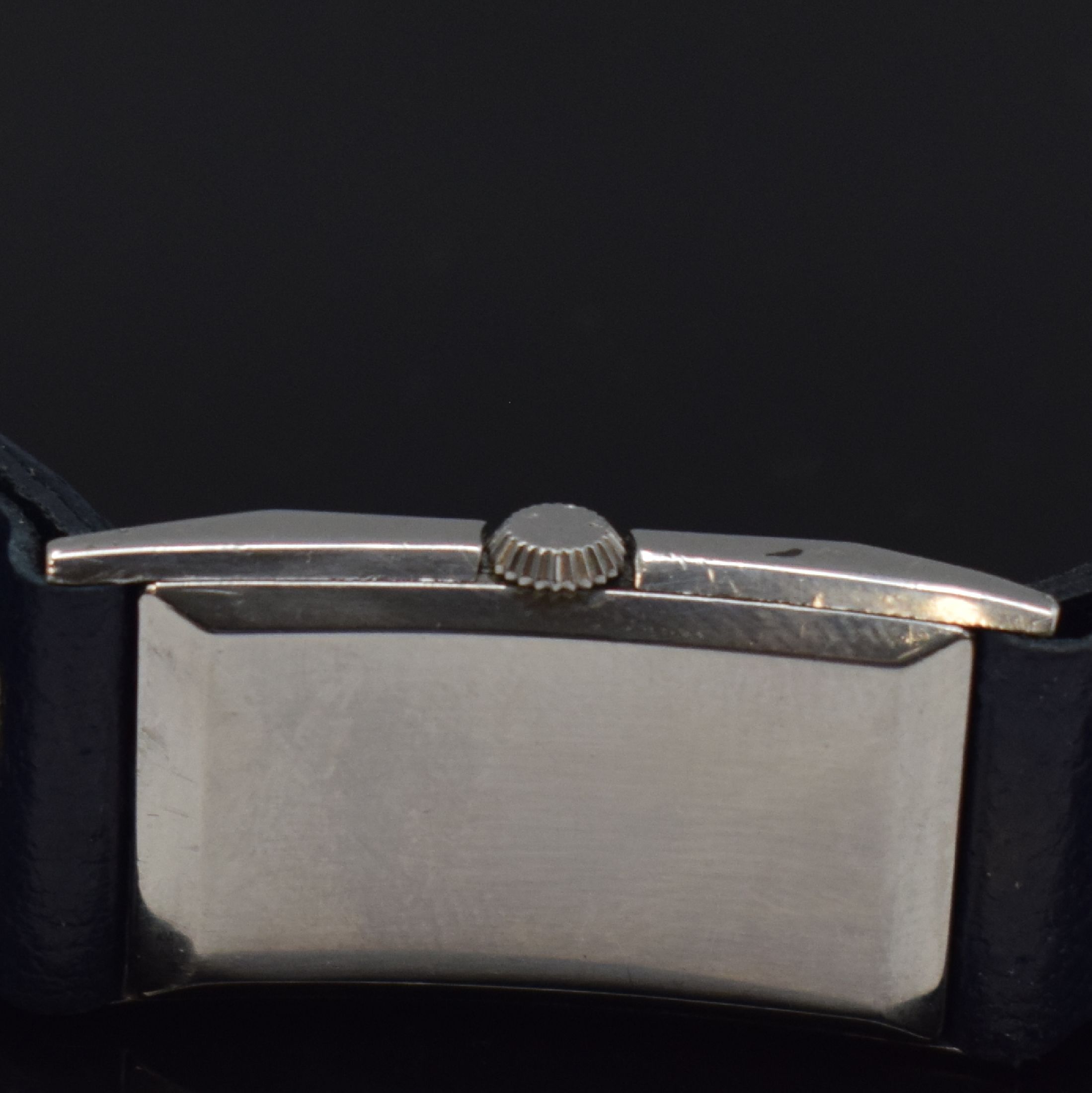 Detail e: OMEGA / ETERNA 2 Armbanduhren in Stahl, Schweiz um 1935 / 1955, Handaufzug / Automatik, 1.) rechteck. OMEGA, gedr. Geh., schwarz. Zifferbl. rest., ...