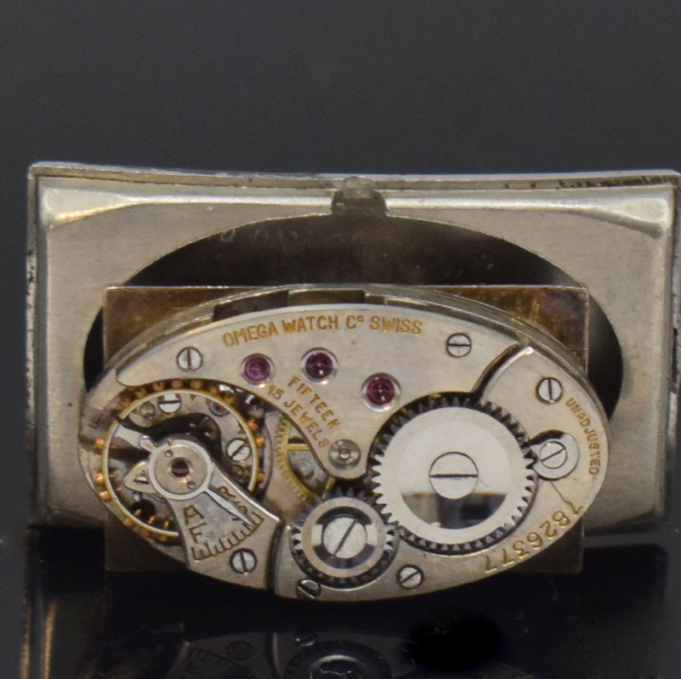 Detail i: OMEGA / ETERNA 2 Armbanduhren in Stahl, Schweiz um 1935 / 1955, Handaufzug / Automatik, 1.) rechteck. OMEGA, gedr. Geh., schwarz. Zifferbl. rest., ...