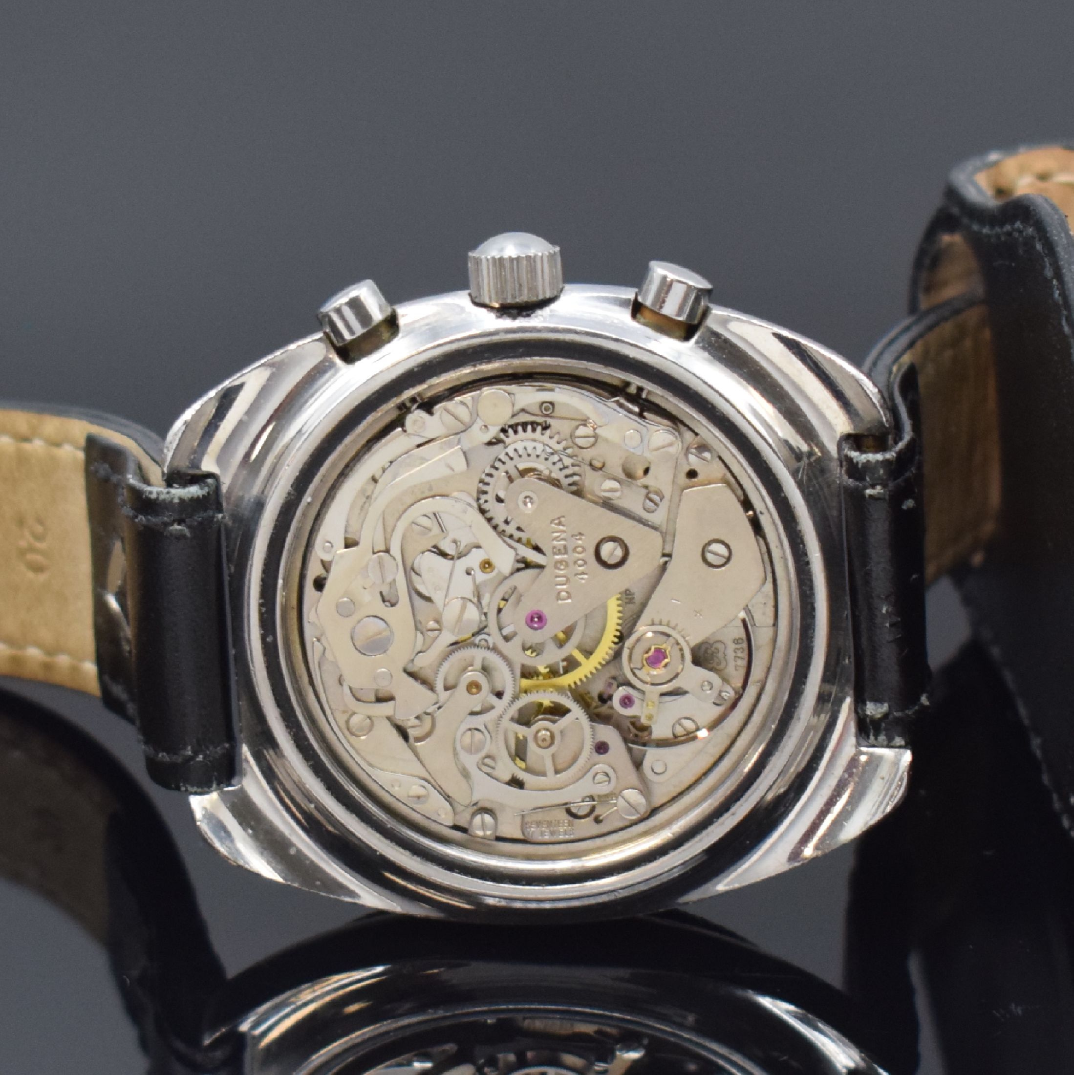 Detail d: DUGENA sportlicher Herrenchronograph in Stahl, Schweiz um 1970, Handaufzug, verschr. Geh., schwarze Drehlunette m. 60er-Tlg., matt-schwarz. ...