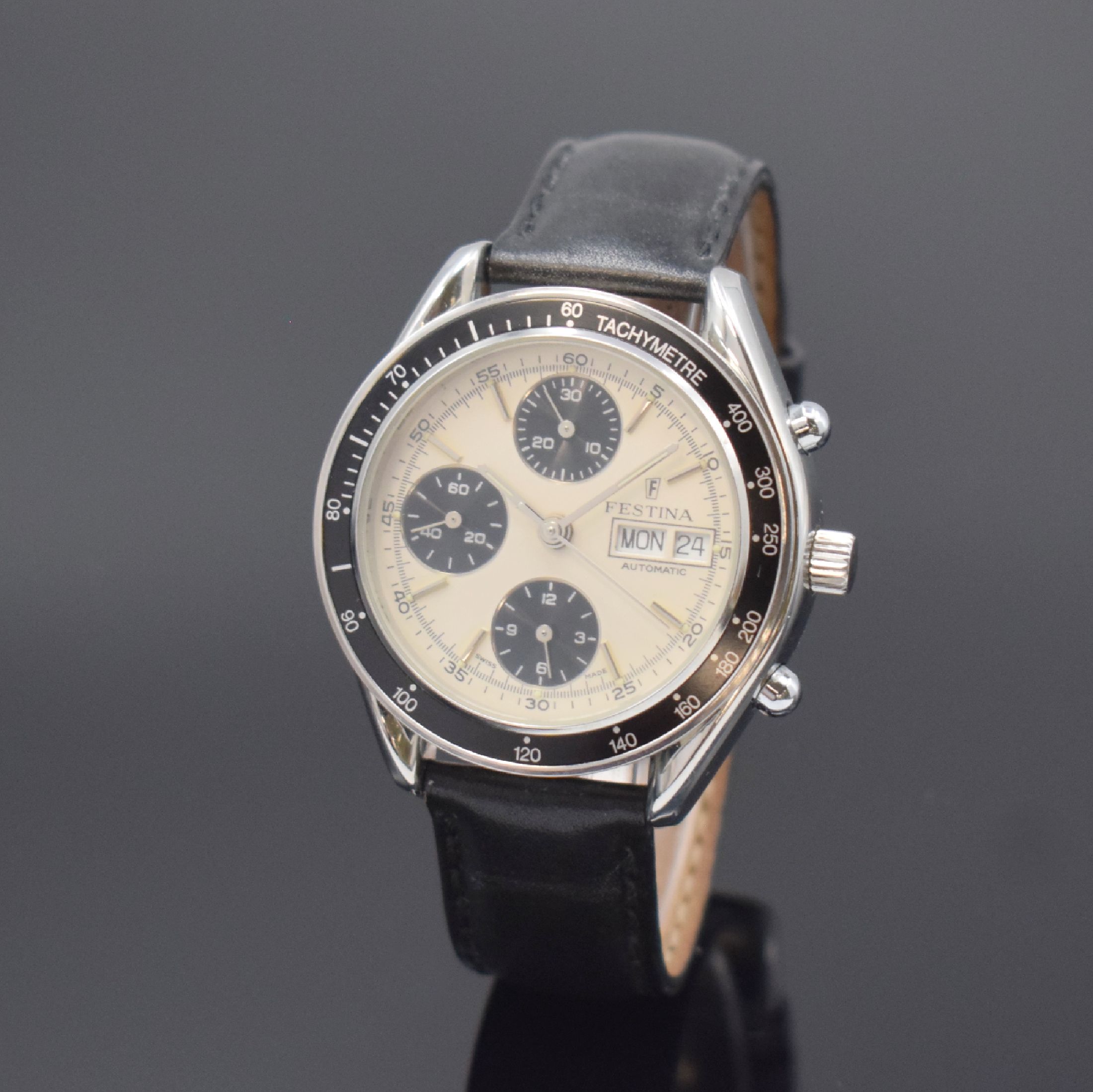 FESTINA Armbandchronograph in Stahl, Schweiz um 1995, Automatik, pol. Geh., Boden u. Krone verschr., schwarze Tachymeter-Lünette, silb. Zifferbl., ...