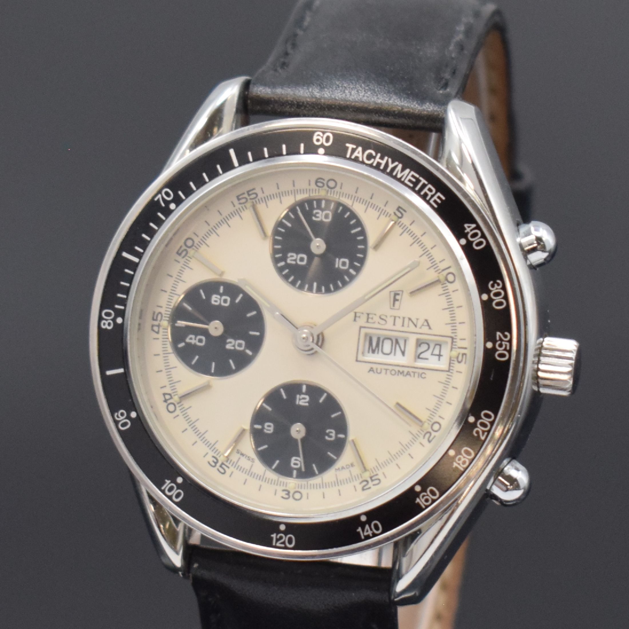 Detail a: FESTINA Armbandchronograph in Stahl, Schweiz um 1995, Automatik, pol. Geh., Boden u. Krone verschr., schwarze Tachymeter-Lünette, silb. Zifferbl., ...
