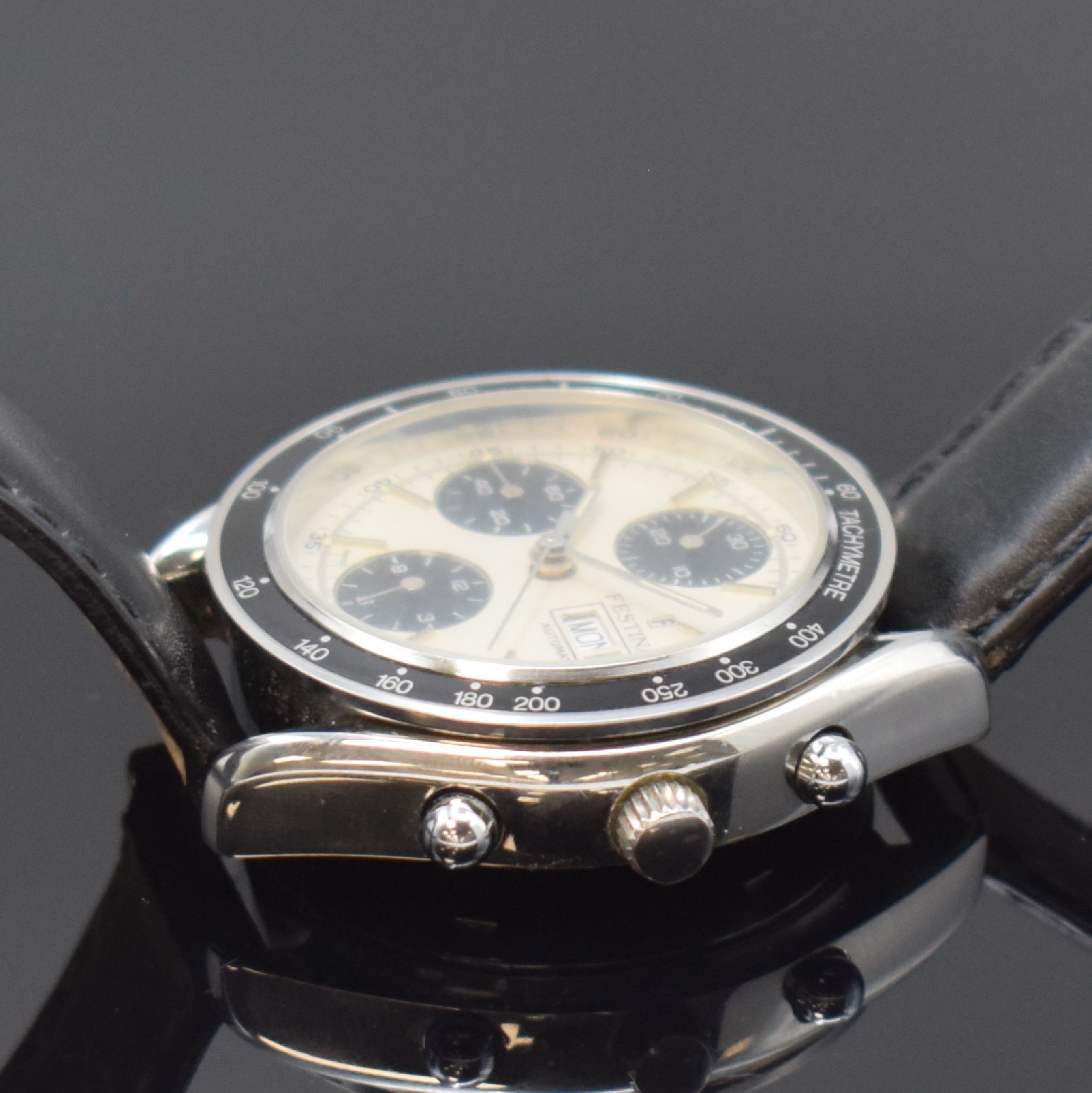Detail b: FESTINA Armbandchronograph in Stahl, Schweiz um 1995, Automatik, pol. Geh., Boden u. Krone verschr., schwarze Tachymeter-Lünette, silb. Zifferbl., ...