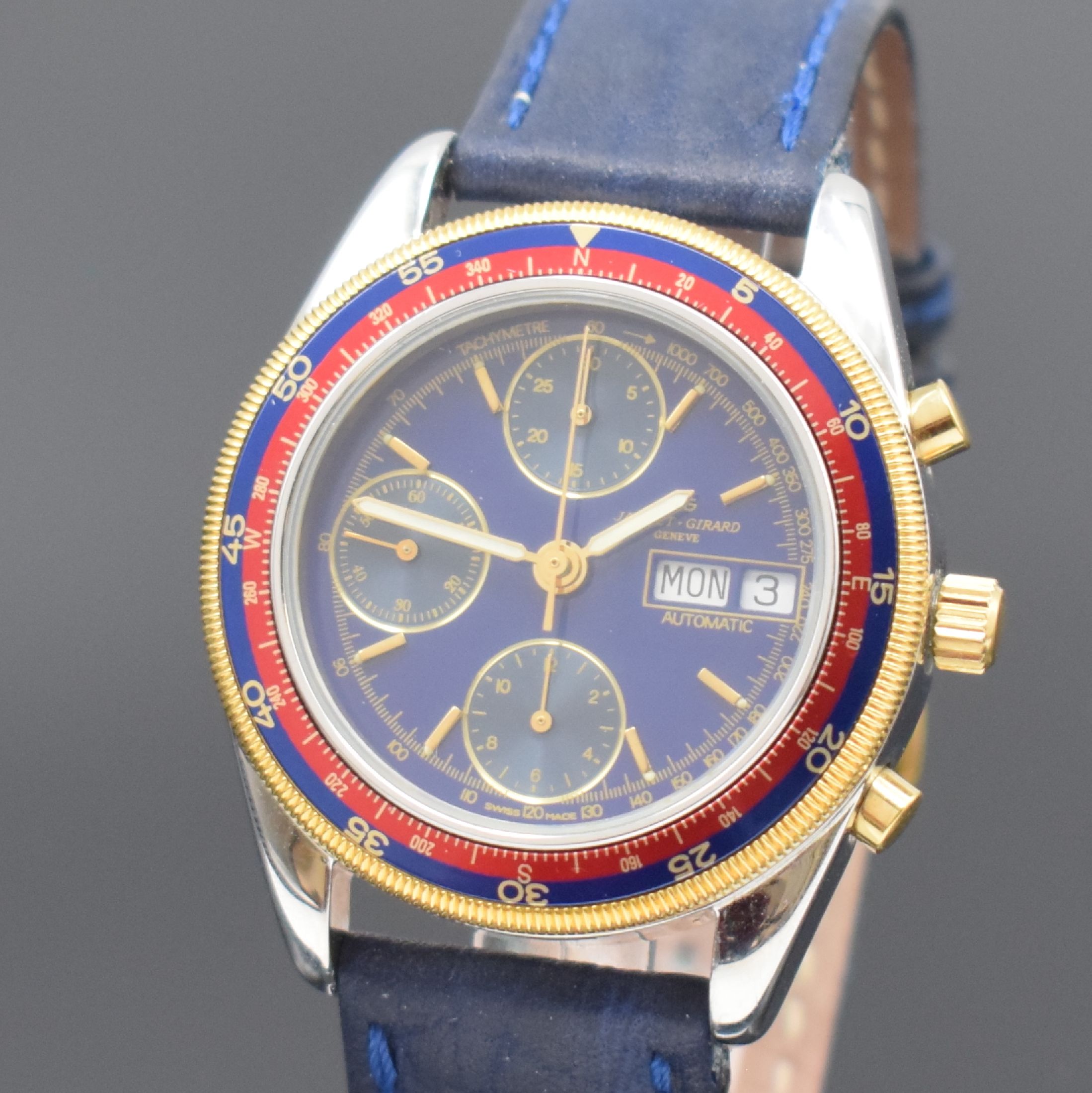 Detail a: JAQUET GIRARD Armbandchronograph in Stahl, Automatik, Schweiz um 2000, Boden und Krone verschr., verg. Riffel-Lünette m. blau/roter Windrose und ...