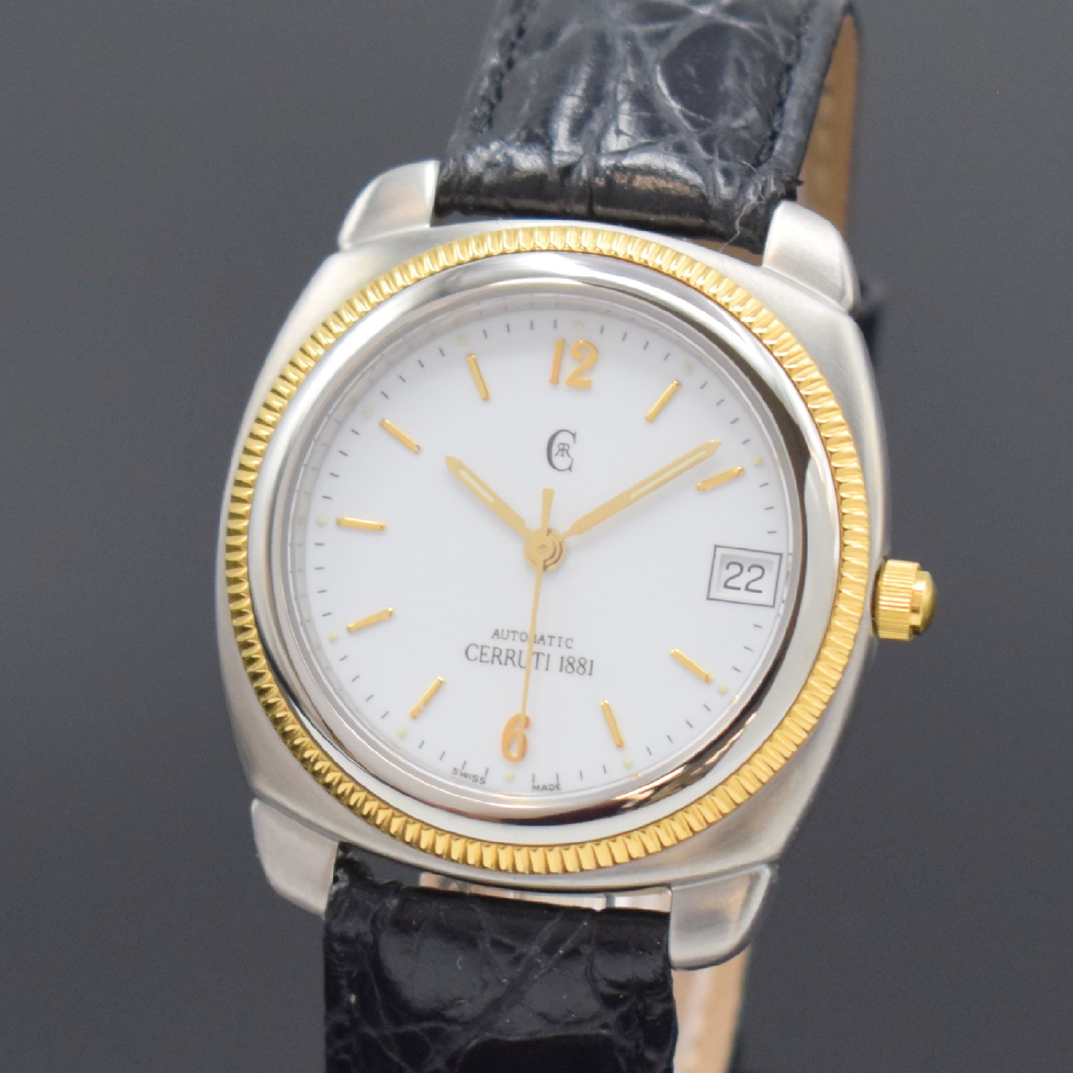 Detail a: CERRUTI Armbanduhr, Automatik, Schweiz um 1995, Stahlgeh. m. verg. Riffel-Lünette, Boden verschr., orig. Lederband, weißes Zifferbl. m. gold. ...