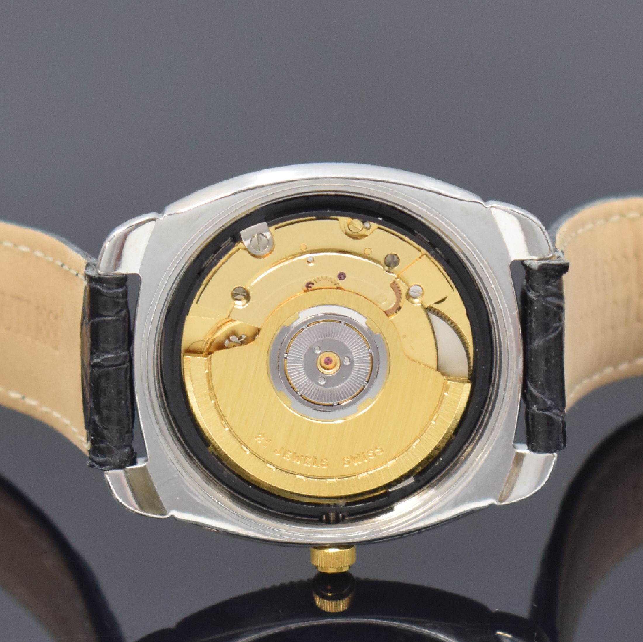 Detail e: CERRUTI Armbanduhr, Automatik, Schweiz um 1995, Stahlgeh. m. verg. Riffel-Lünette, Boden verschr., orig. Lederband, weißes Zifferbl. m. gold. ...