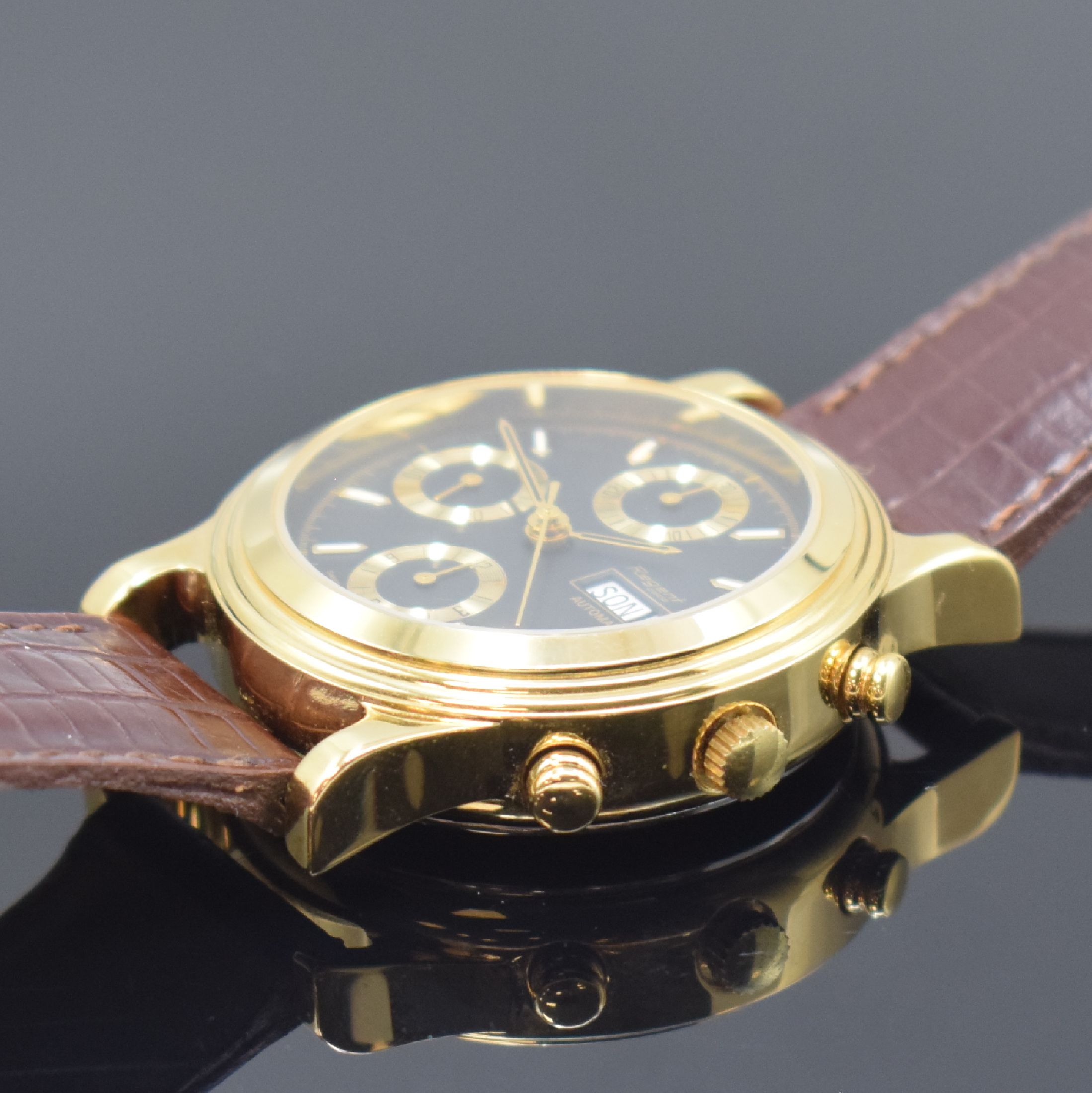 Detail b: REGENT Armbandchronograph, Automatik, Schweiz um 1990, verg. Geh., Edelstahlboden aufgedr., schwarzes Zifferbl. m. gold. Indizes, Tag und Datum bei ...