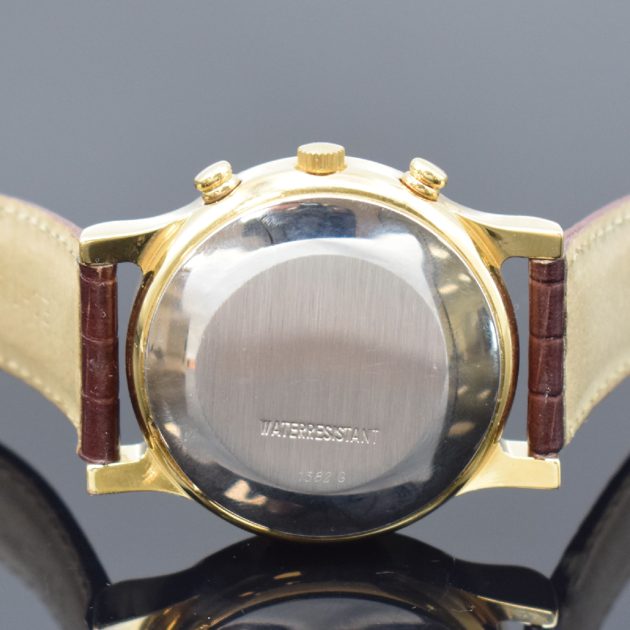 Detail c: REGENT Armbandchronograph, Automatik, Schweiz um 1990, verg. Geh., Edelstahlboden aufgedr., schwarzes Zifferbl. m. gold. Indizes, Tag und Datum bei ...