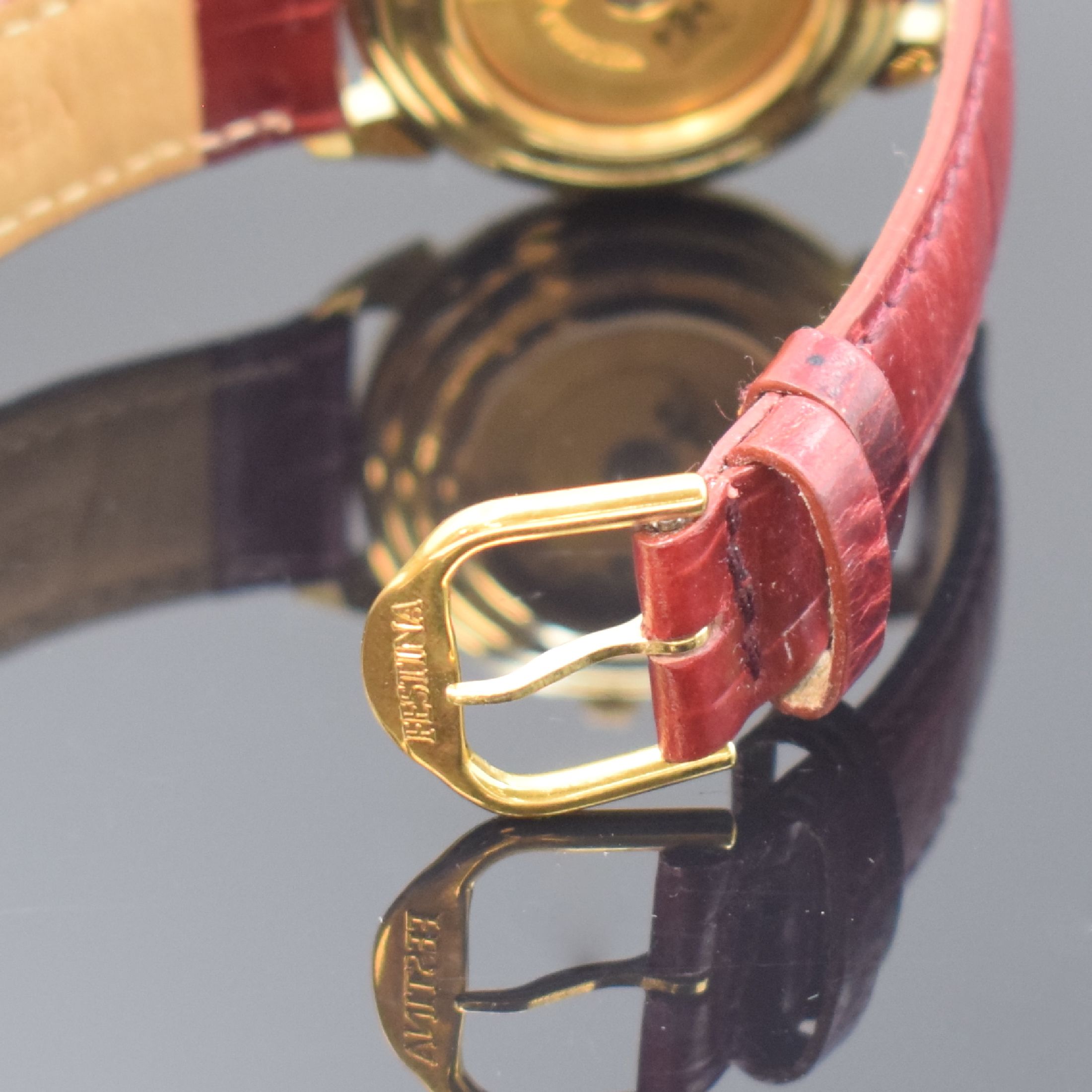 Detail b: FESTINA Armbanduhr, Automatik, Schweiz um 1990, verg. Geh. beids. vergl., Boden aufgedr., silb. Strukturzifferbl. m. röm. Zahlen, Datum bei 3, verg. ...