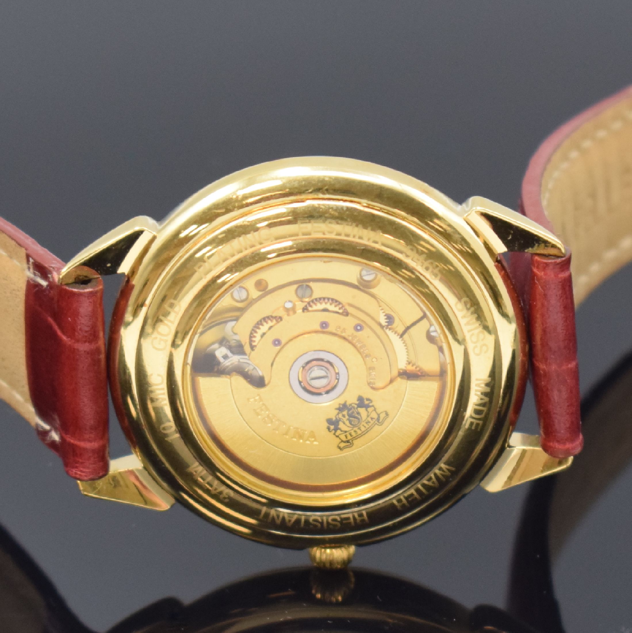 Detail e: FESTINA Armbanduhr, Automatik, Schweiz um 1990, verg. Geh. beids. vergl., Boden aufgedr., silb. Strukturzifferbl. m. röm. Zahlen, Datum bei 3, verg. ...