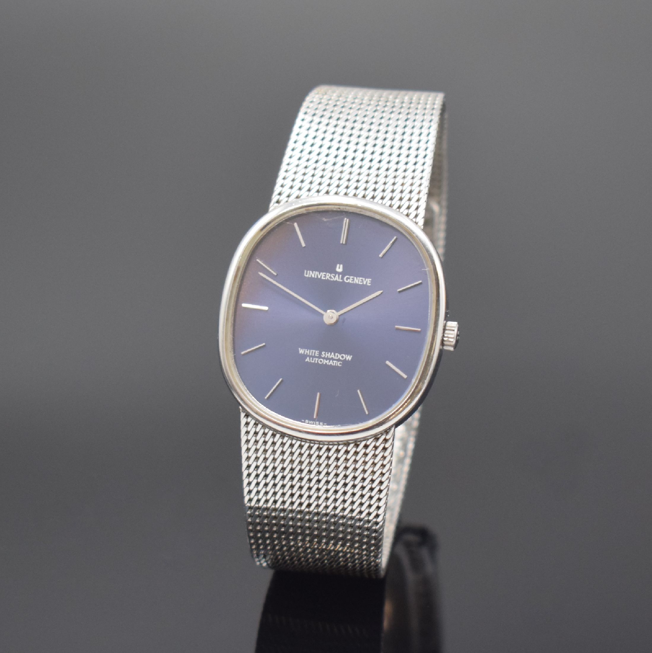 UNIVERSAL GENEVE White Shadow Armbanduhr Referenz 866051, Schweiz um 1985, Automatik, Edelstahlgeh. inkl. Meshband, Boden aufgedr., blaues Zifferbl. ...