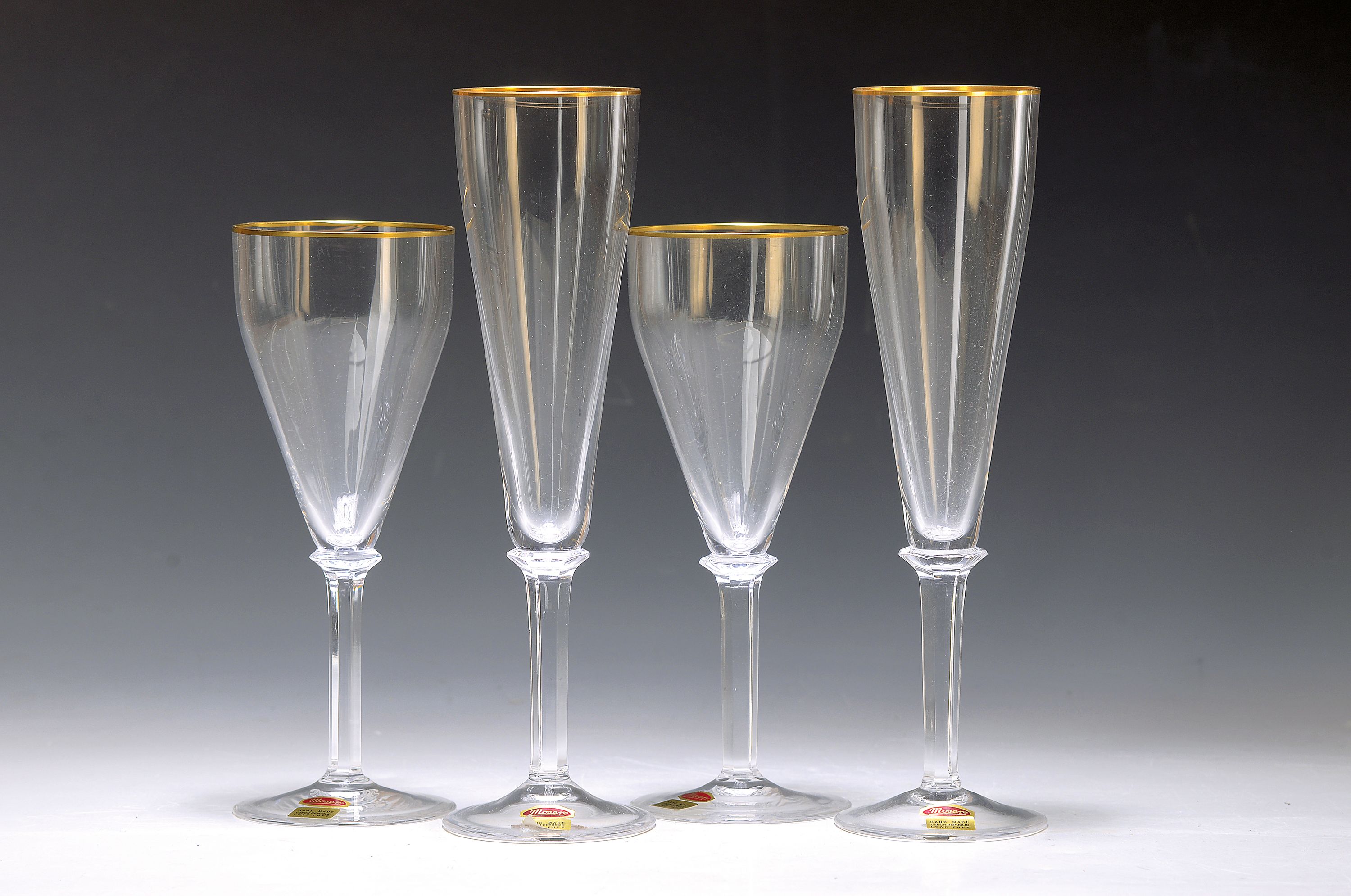 Gläserset, Moser Karlsbad, 6 Sektflöten u. 5 Weingläser, farbloses Glas, optisch geblasen, Goldränder, H.ca. 24.5/20 cm