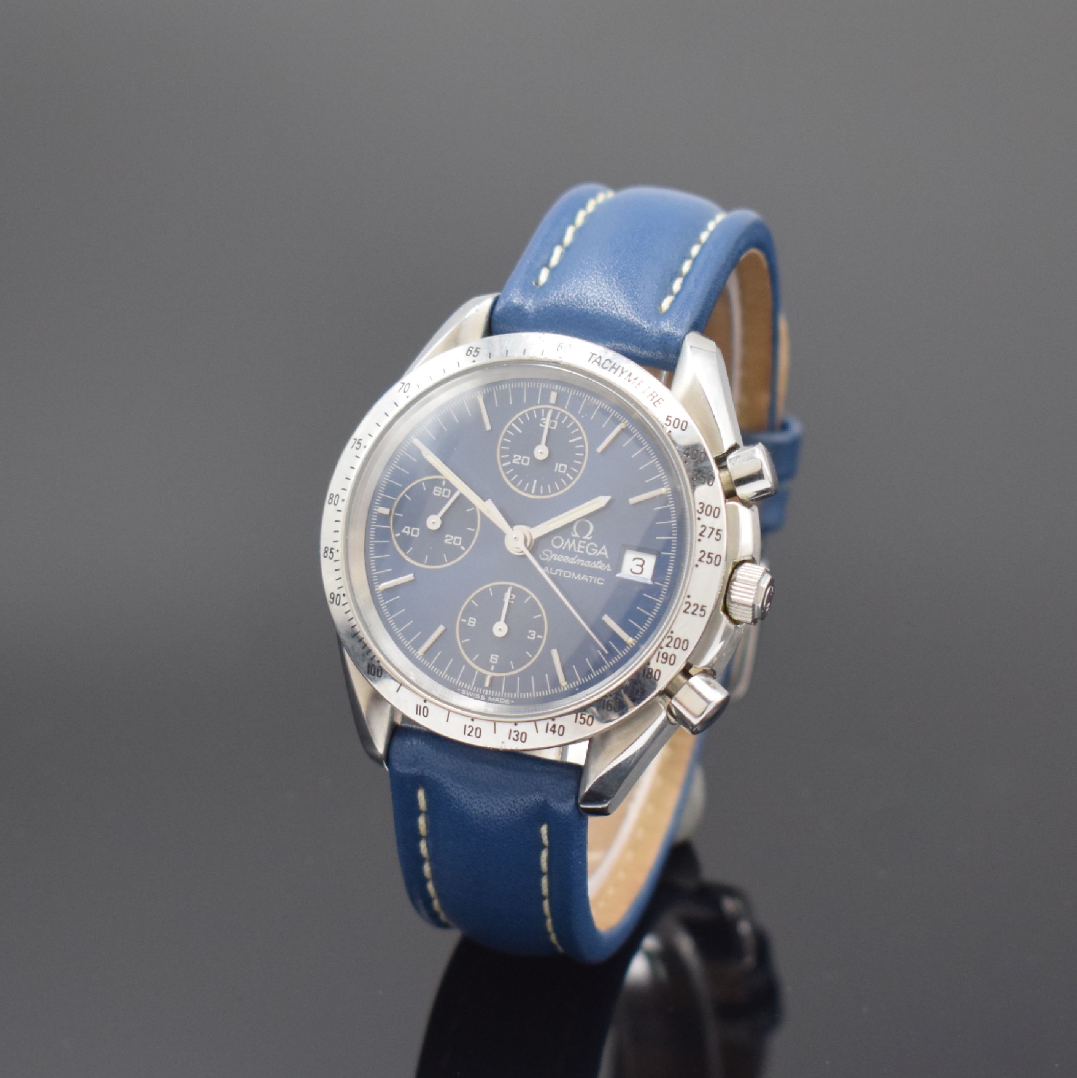 OMEGA Speedmaster Armbandchronograph in Stahl Referenz 175.0043, Schweiz um 1995, Automatik, Boden aufgedr., Lünette m. Tachymeterskala, blaues ...