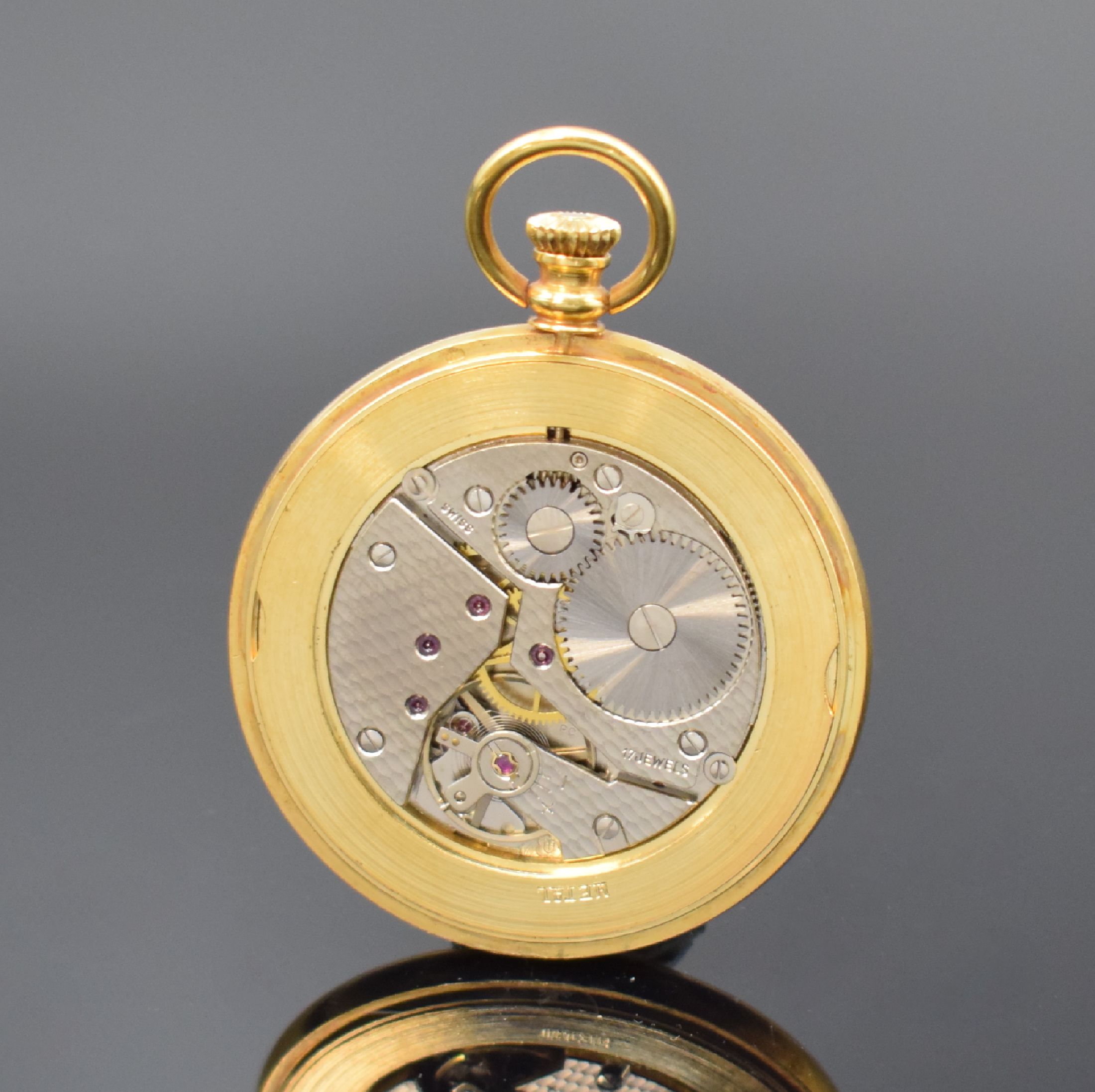 Detail c: COMOR offene Taschenuhr in GG 750/000, Schweiz um 1990, weißes Zifferbl. m. röm. Zahlen, schwarze Zeiger, Rückseite aufw. floral grav., Kal. ...