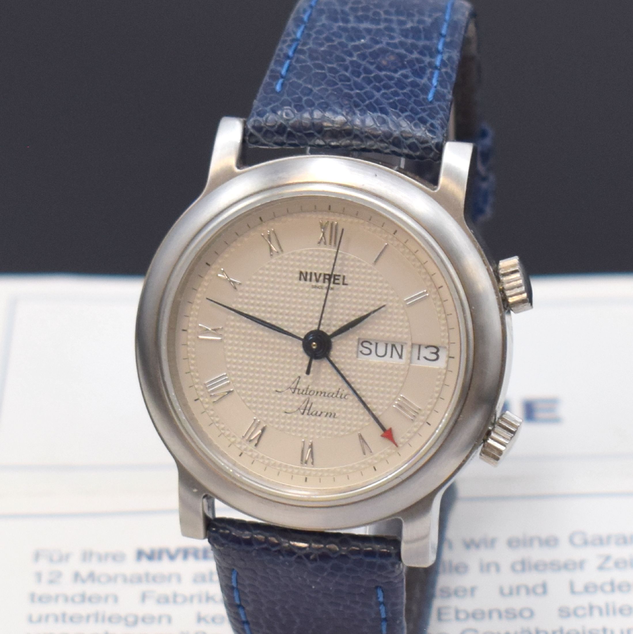 Detail a: NIVREL Herrenarmbanduhr mit Wecker, Automatik, Schweiz verk. lt. beil. Pap. 03/1999, Edelstahlgehäuse inkl. orig. Lederband mit orig. Dornschließe, ...