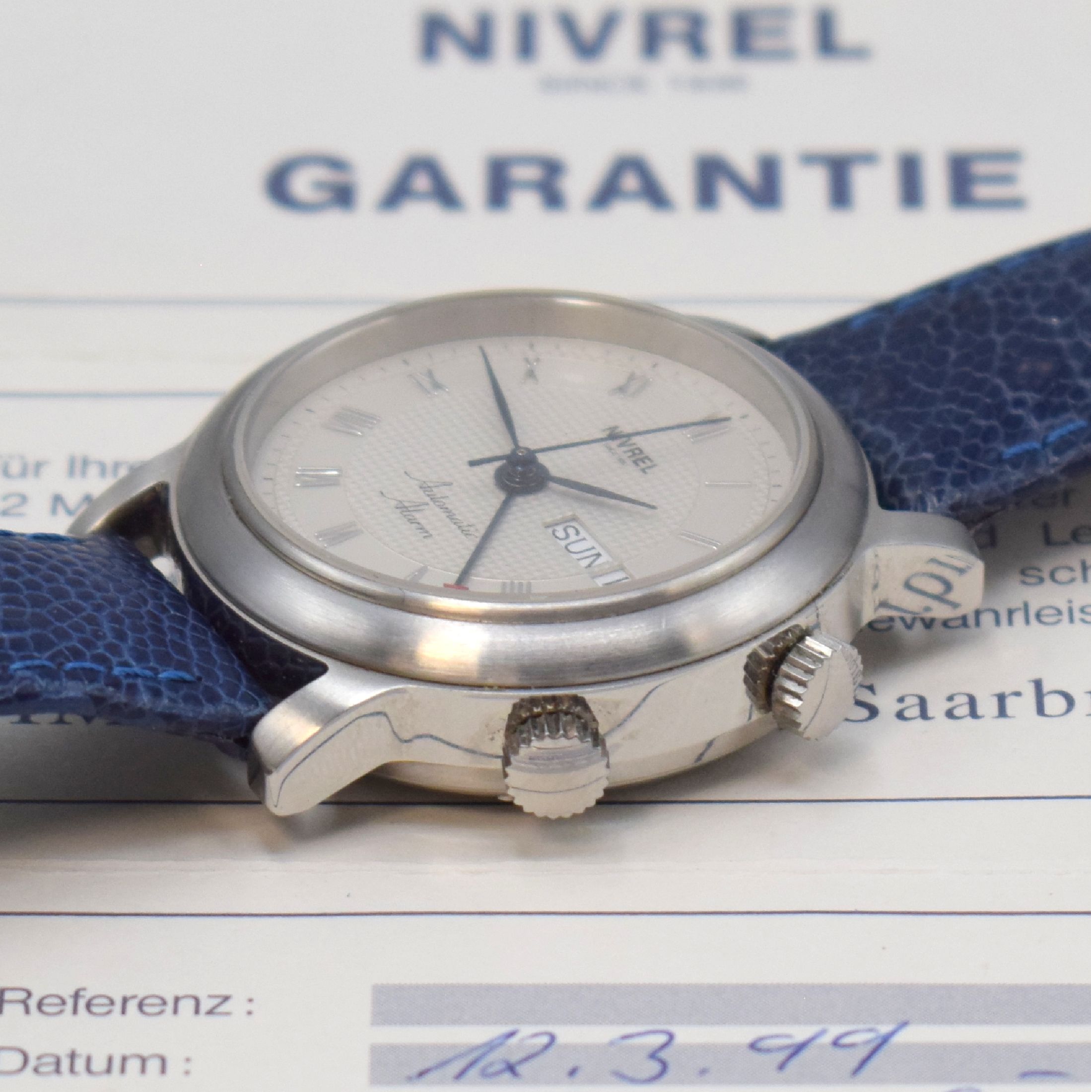 Detail b: NIVREL Herrenarmbanduhr mit Wecker, Automatik, Schweiz verk. lt. beil. Pap. 03/1999, Edelstahlgehäuse inkl. orig. Lederband mit orig. Dornschließe, ...
