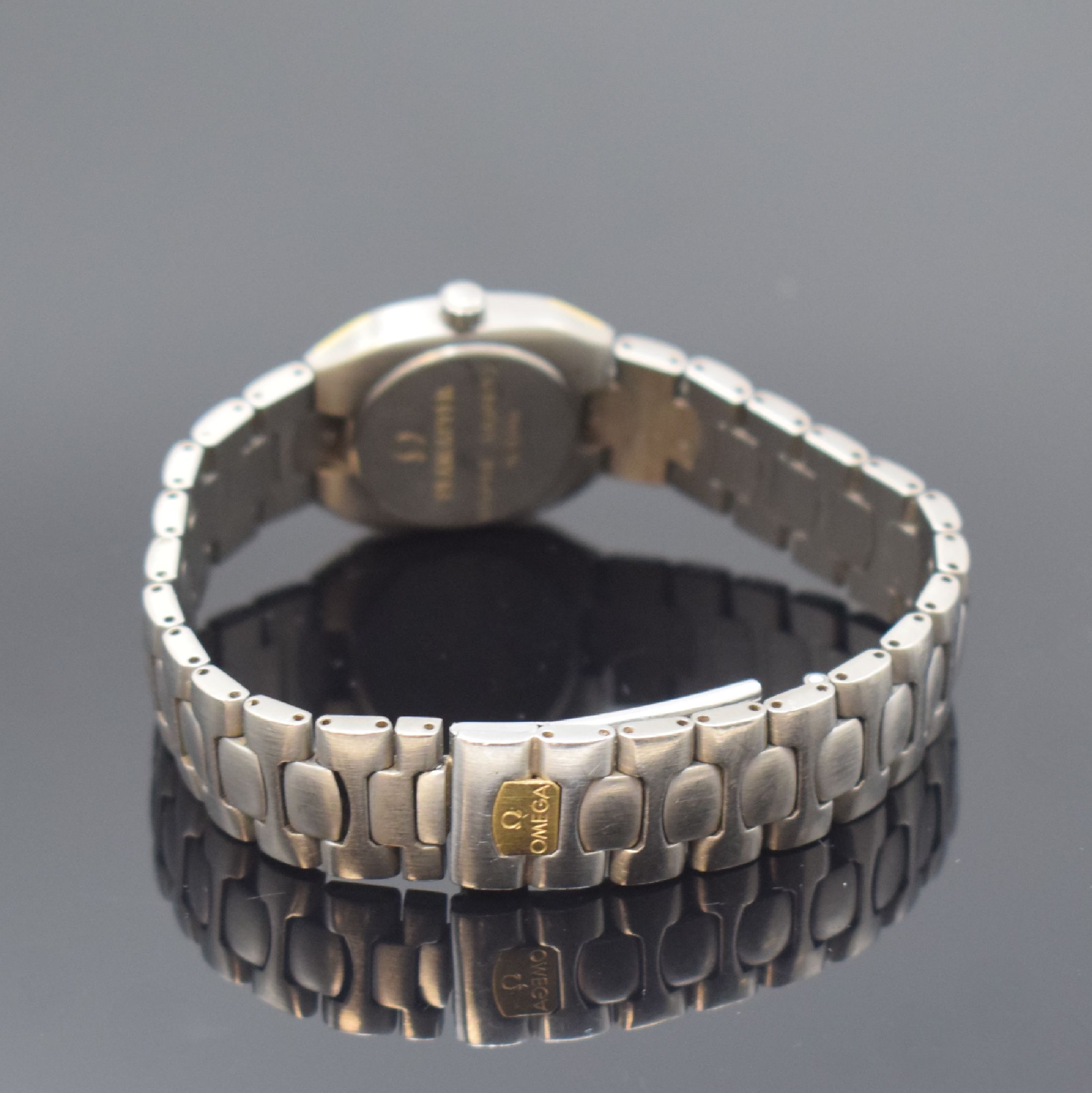 Detail b: OMEGA Seamaster Polaris Damenarmbanduhr, Schweiz um 1985, quarz, z.T. goldintarsiertes Titangeh., Boden aufgedr., Titanband m. Faltschl., graues ...