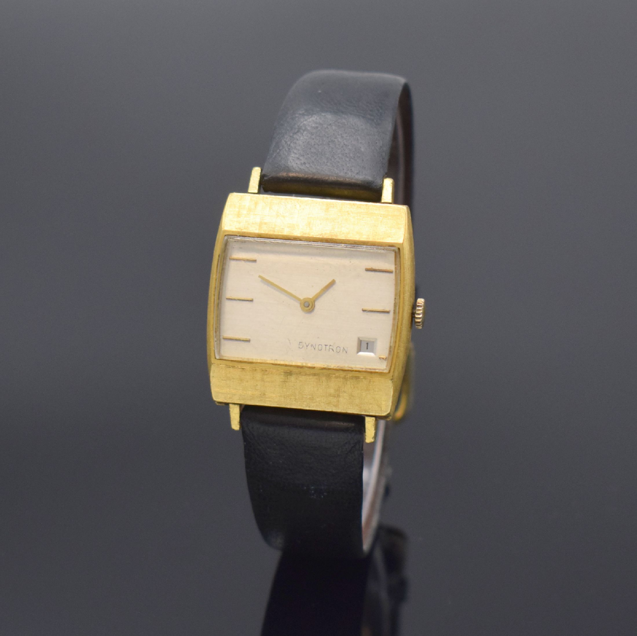 DYNOTRON Armbanduhr in GG 750/000, Schweiz um 1970, quarz, dell. Boden aufgedr., silb. Zifferbl. m. gold. Std.-Ind., gold. Zeiger, Datum, Kal. ESA ...