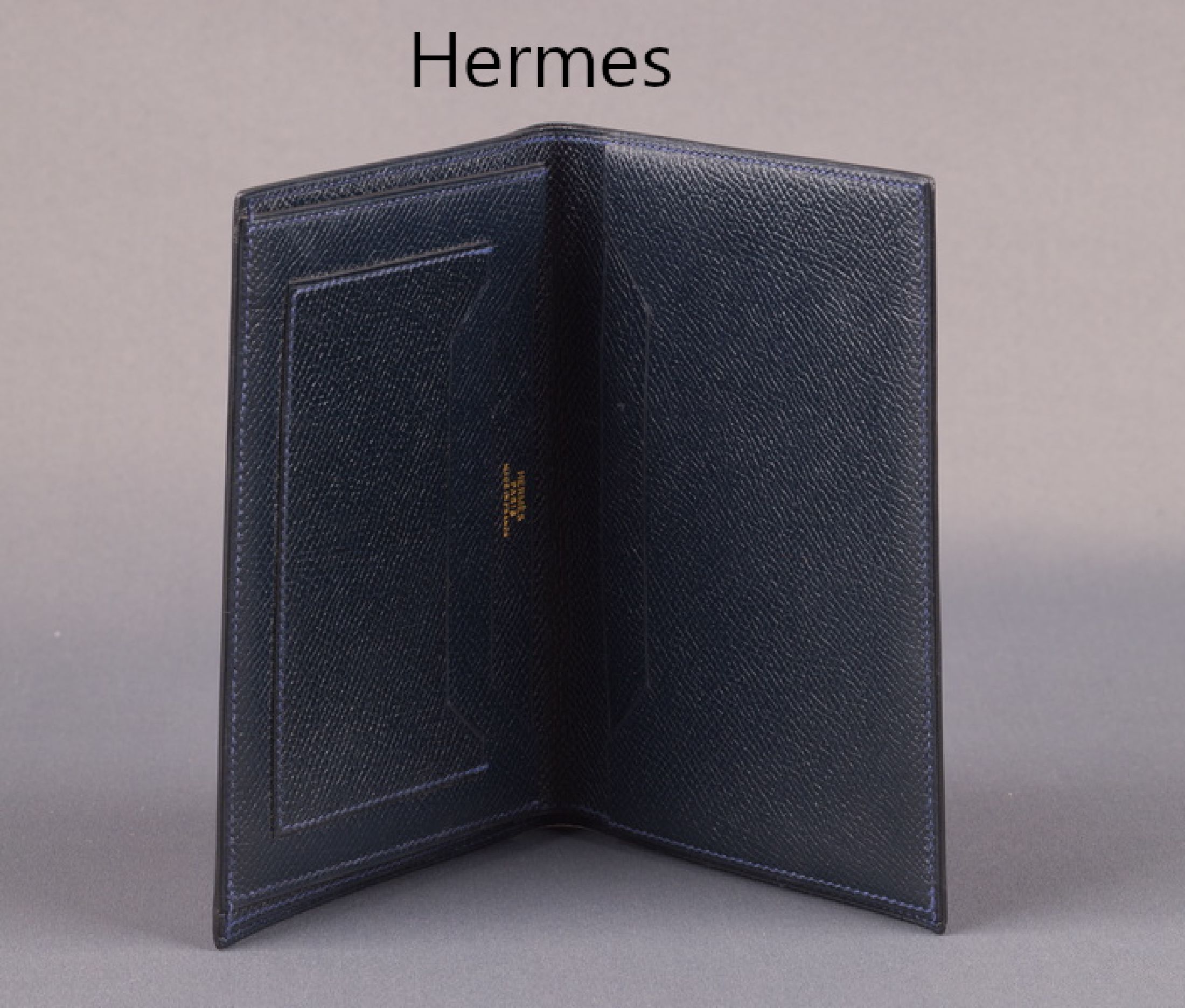 HERMES Brieftasche, dunkelblaues Leder, 1 Scheinfach, Kartenfächer und Seitenfächer, ca.10.5 x 15 cm, min. Gebr.-Spuren