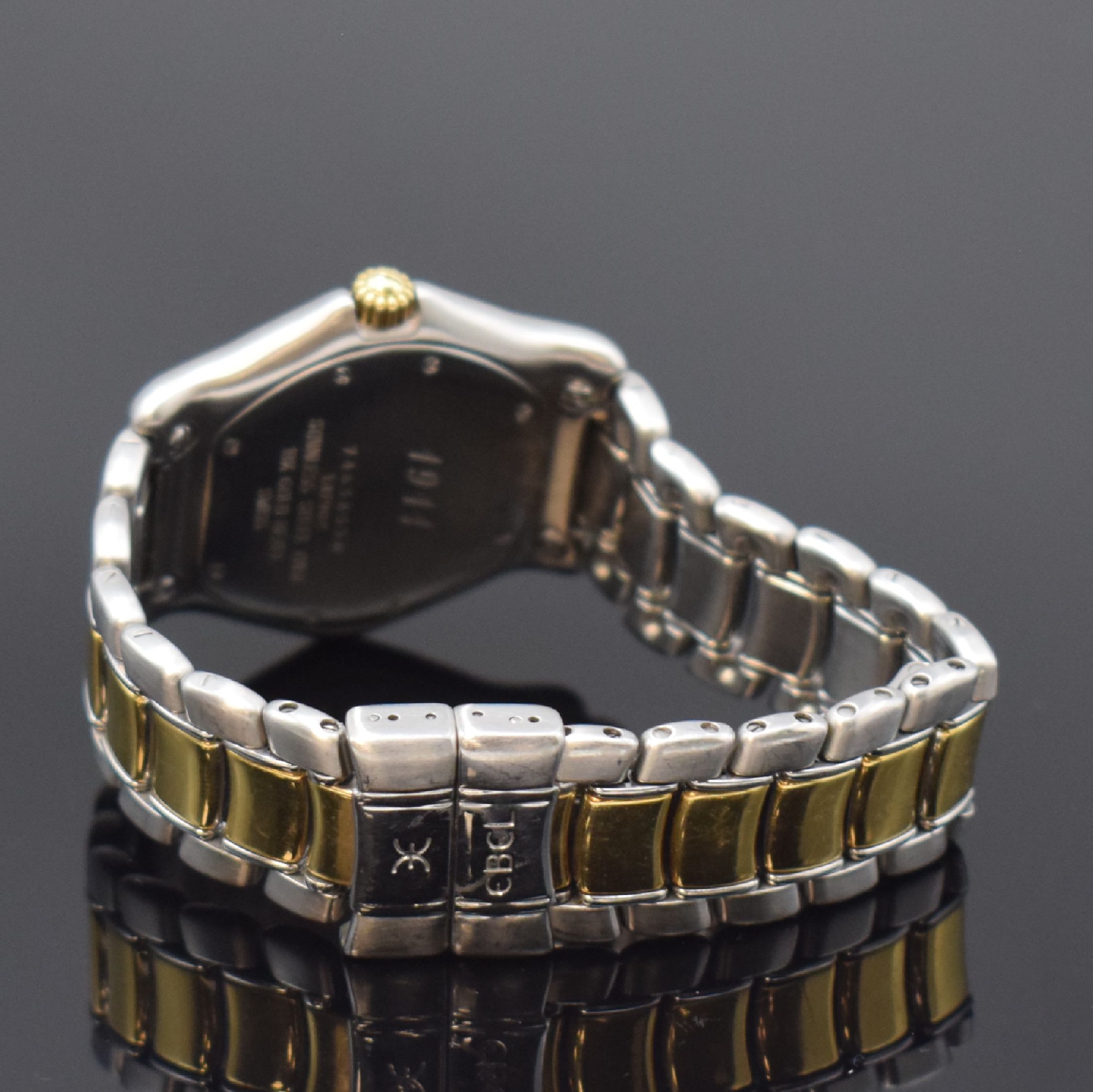 Detail b: EBEL Armbanduhr Serie 1911 Referenz 187902, Schweiz um 1995, quarz, Edelstahlgeh. inkl. z. T. verg. Gliederband m. Faltschl., 18k Goldlünette gegen ...