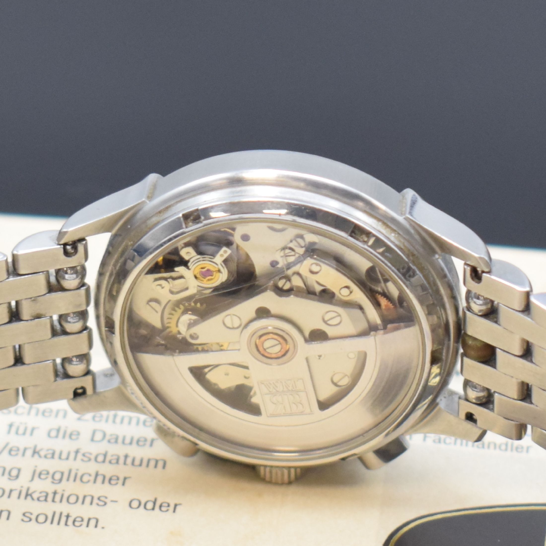 Detail e: RAINER BRAND Armbandchronograph Modell Axiom, Automatik, Edelstahlgeh. inkl. orig. Gliederband m. dopp. Faltschl., beids. vergl., Boden verschr., ...