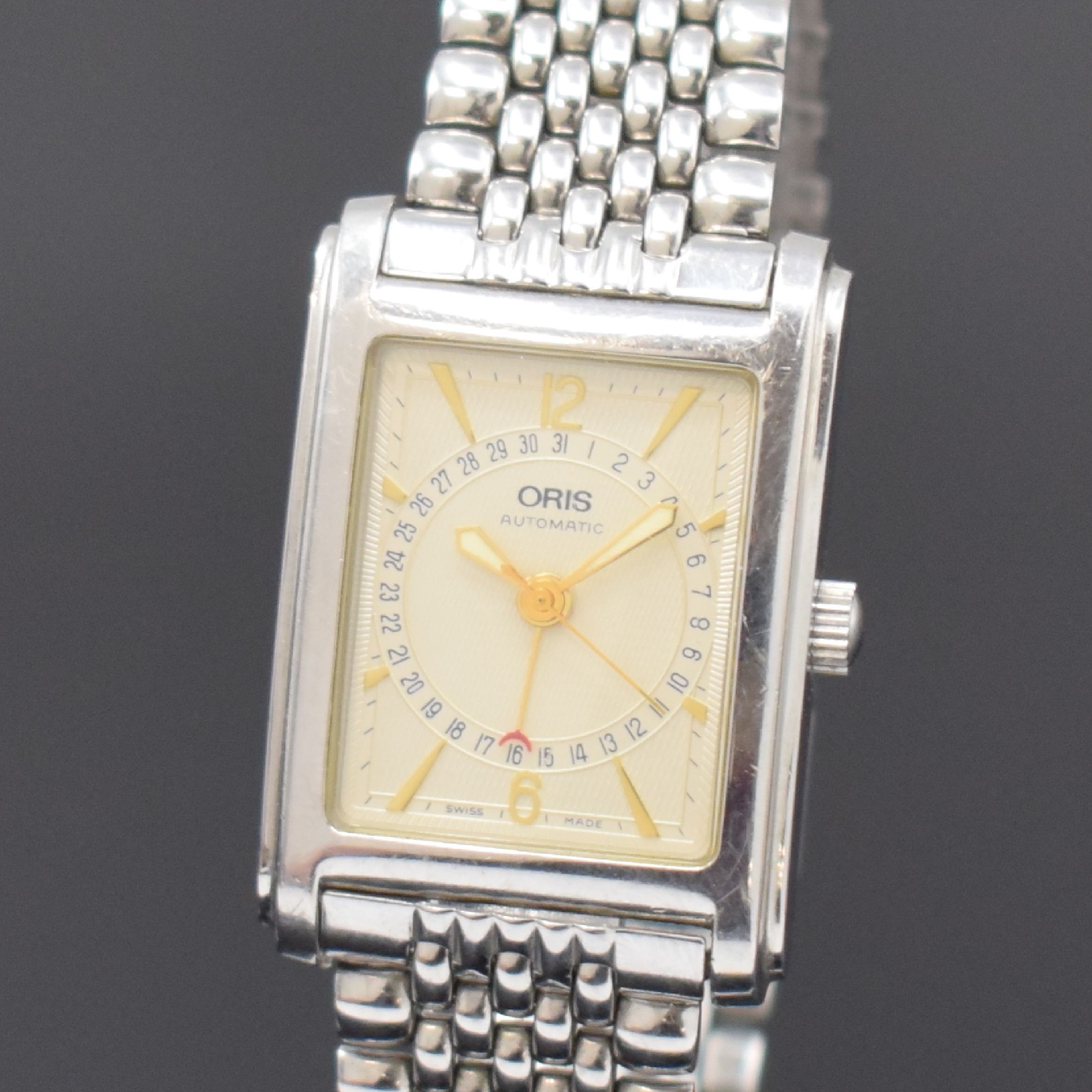 Detail a: ORIS rechteckige Armbanduhr mit Zeigerdatum Referenz B7460, Schweiz um 1995, Edelstahlgeh. inkl. Gliederband m. Faltschl., Boden 4-fach verschr., ...
