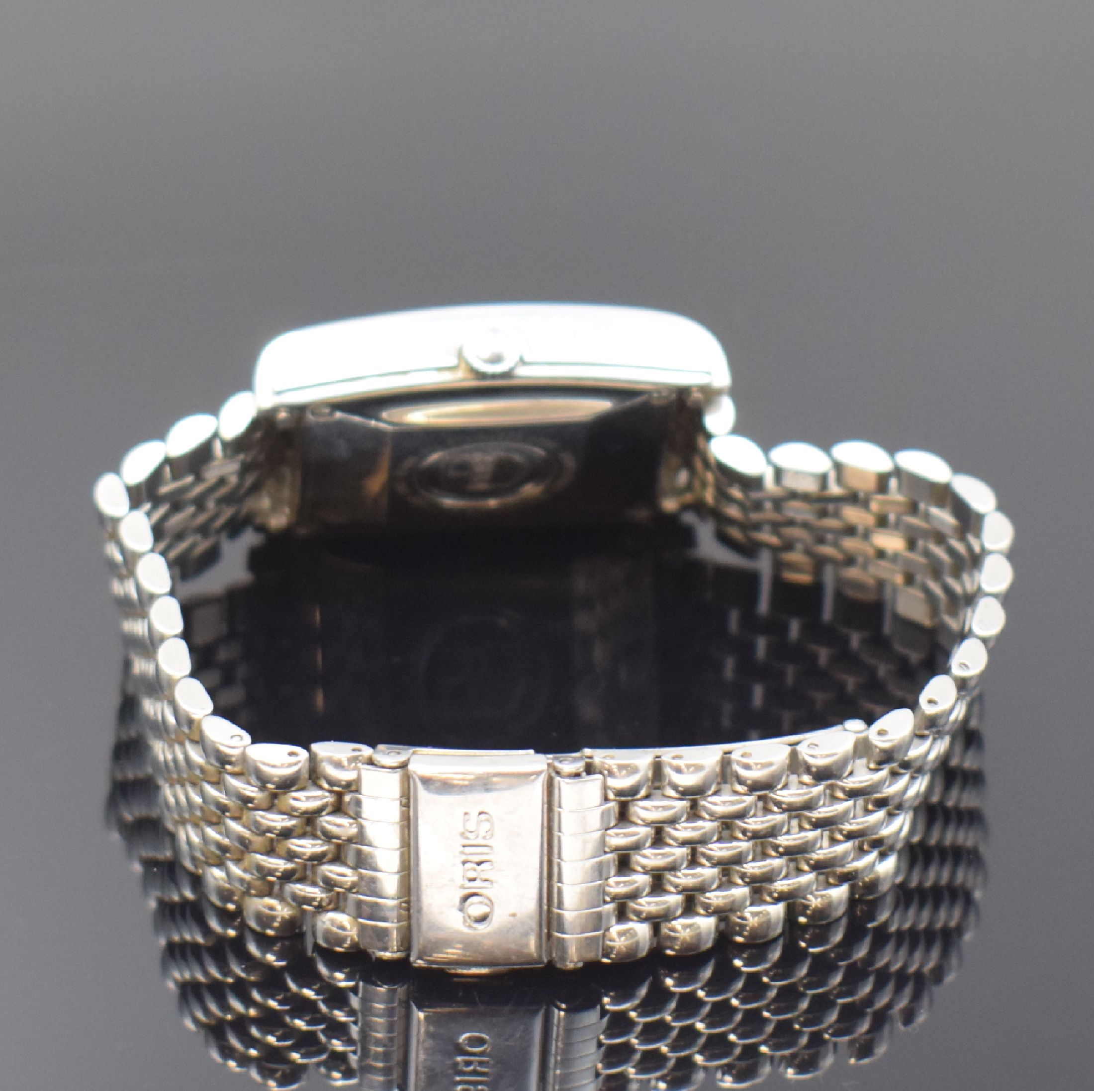 Detail b: ORIS rechteckige Armbanduhr mit Zeigerdatum Referenz B7460, Schweiz um 1995, Edelstahlgeh. inkl. Gliederband m. Faltschl., Boden 4-fach verschr., ...