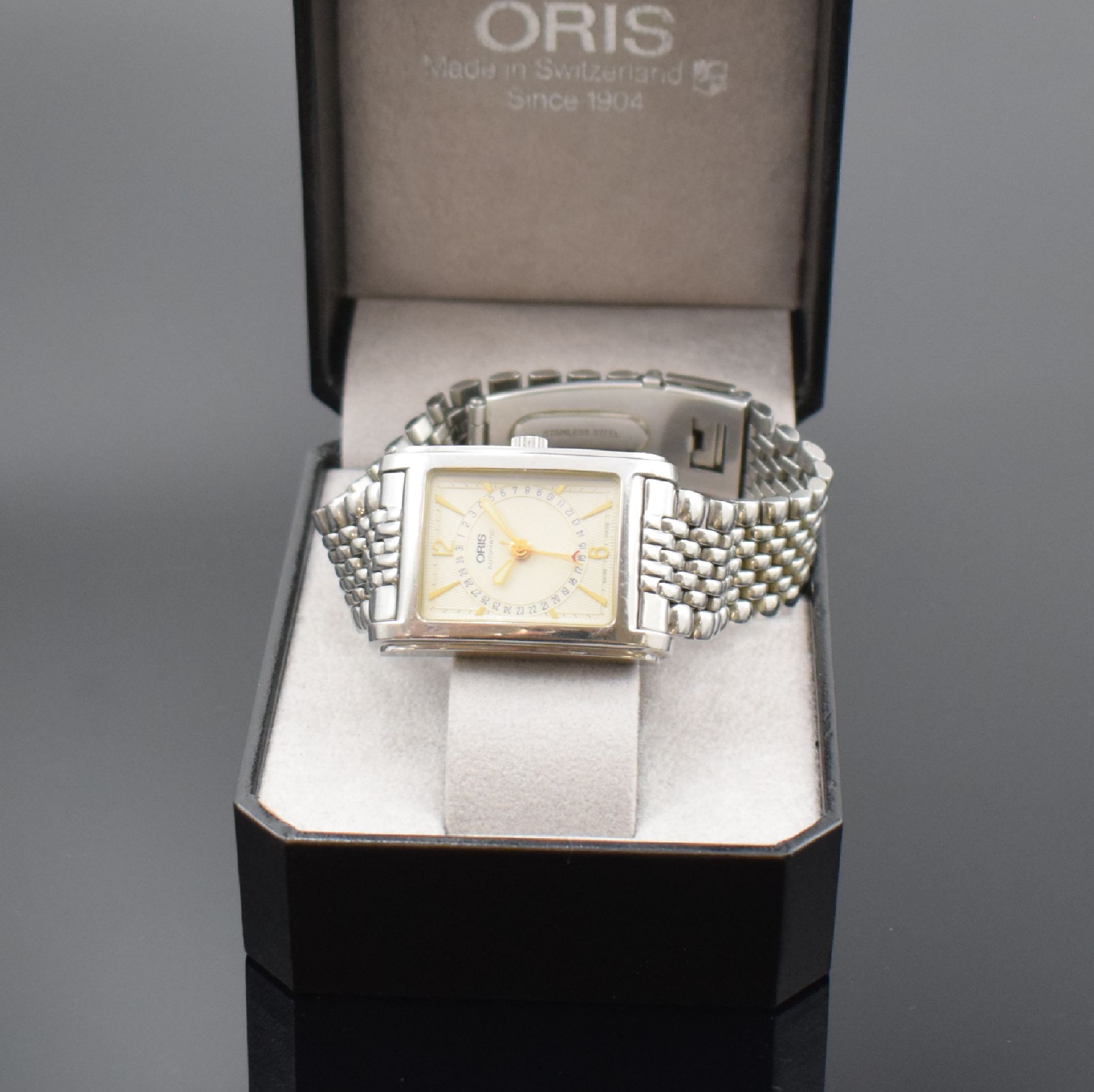 Detail e: ORIS rechteckige Armbanduhr mit Zeigerdatum Referenz B7460, Schweiz um 1995, Edelstahlgeh. inkl. Gliederband m. Faltschl., Boden 4-fach verschr., ...
