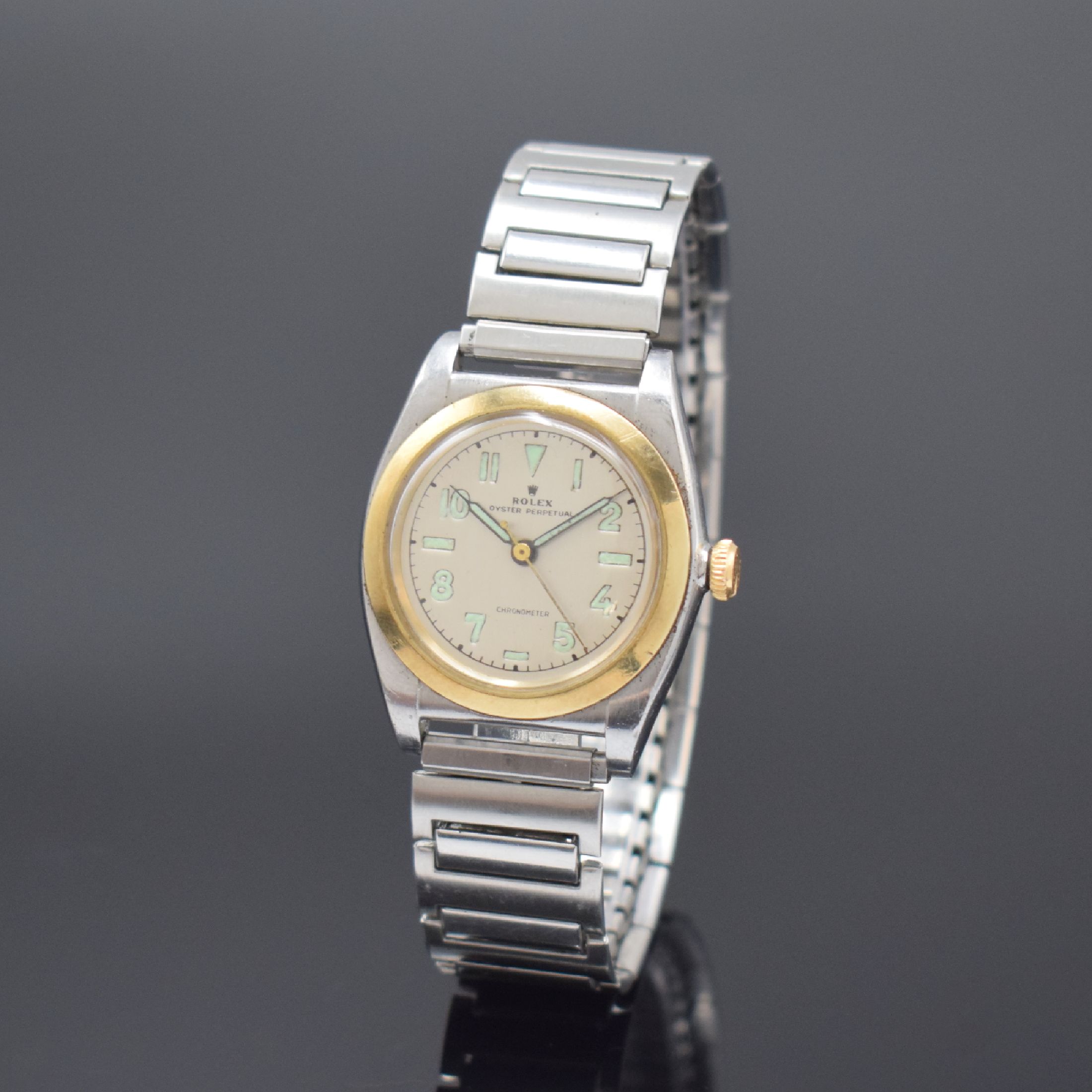 ROLEX Oyster Perpetual Bubble Back Herrenarmbanduhr Referenz 3133, Schweiz um 1945, Automatik, verschr. Edelstahlgehäuse mit Goldlünette, Flexband, ...