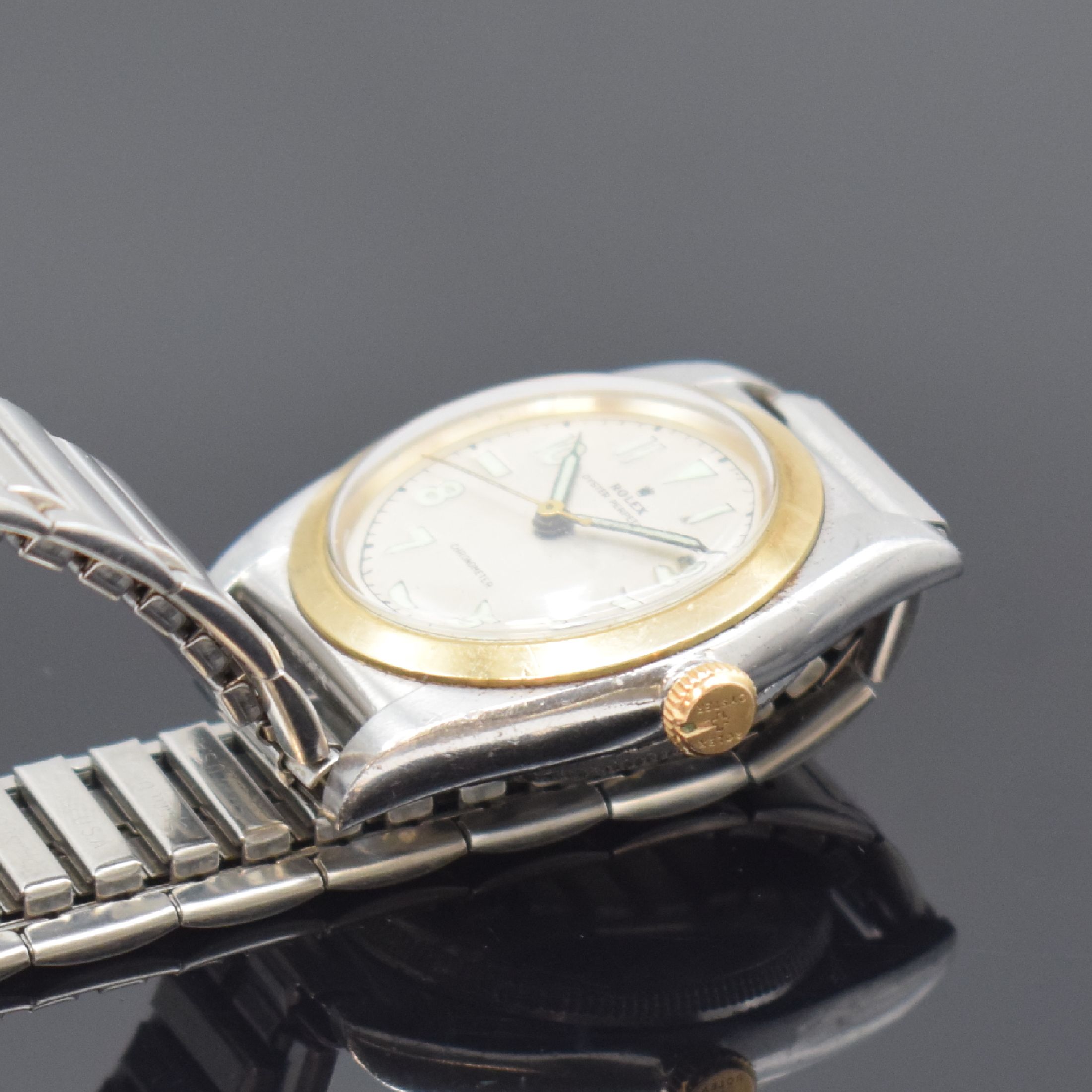 Detail b: ROLEX Oyster Perpetual Bubble Back Herrenarmbanduhr Referenz 3133, Schweiz um 1945, Automatik, verschr. Edelstahlgehäuse mit Goldlünette, Flexband, ...