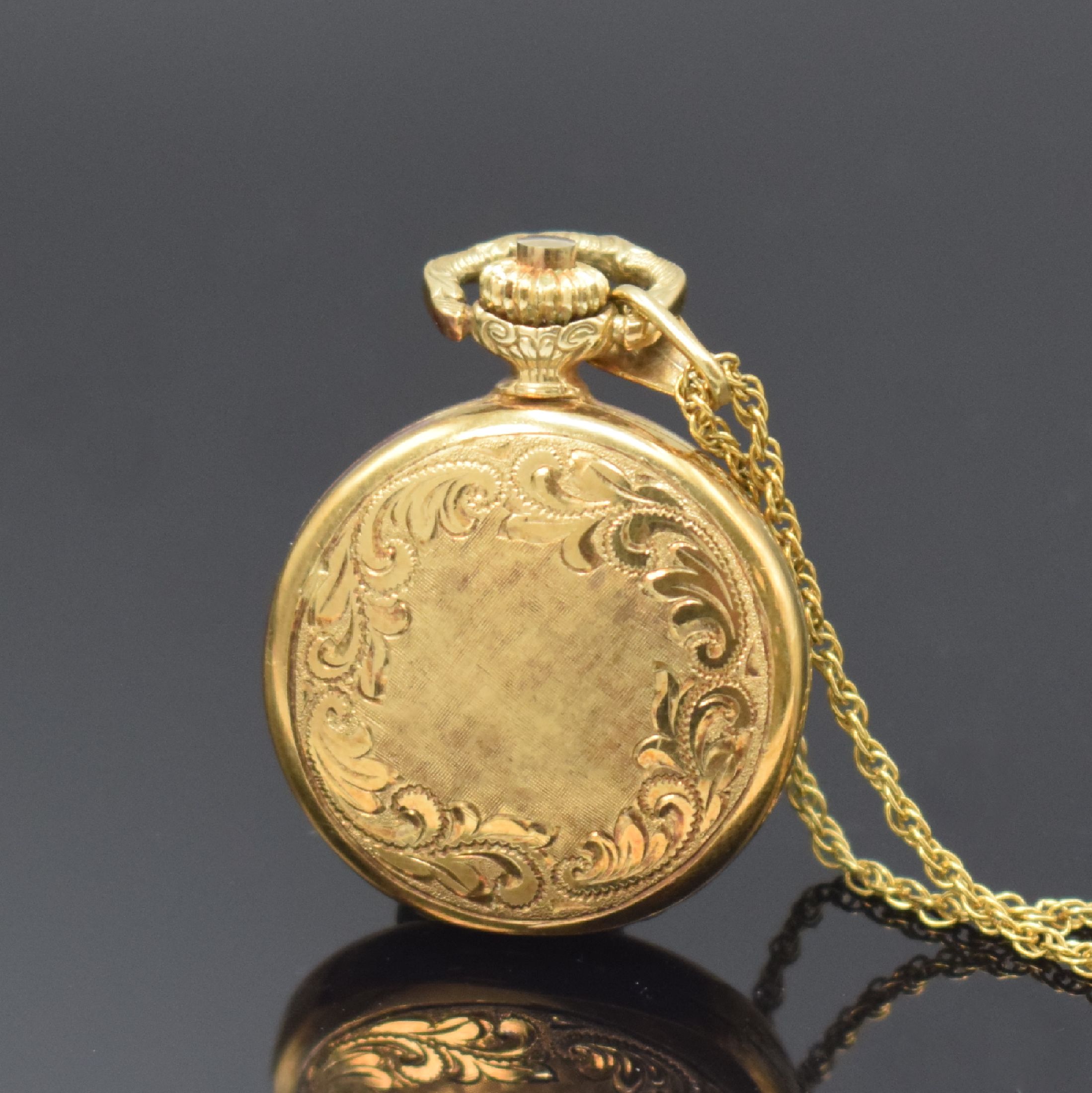 Detail b: AMARA Damentaschenuhr in GG 585/000 mit Goldkette, Schweiz um 1975, Handaufzug, gold. Zifferbl. m. röm. Zahlen, schwarze Zeiger, Kette in GG ...