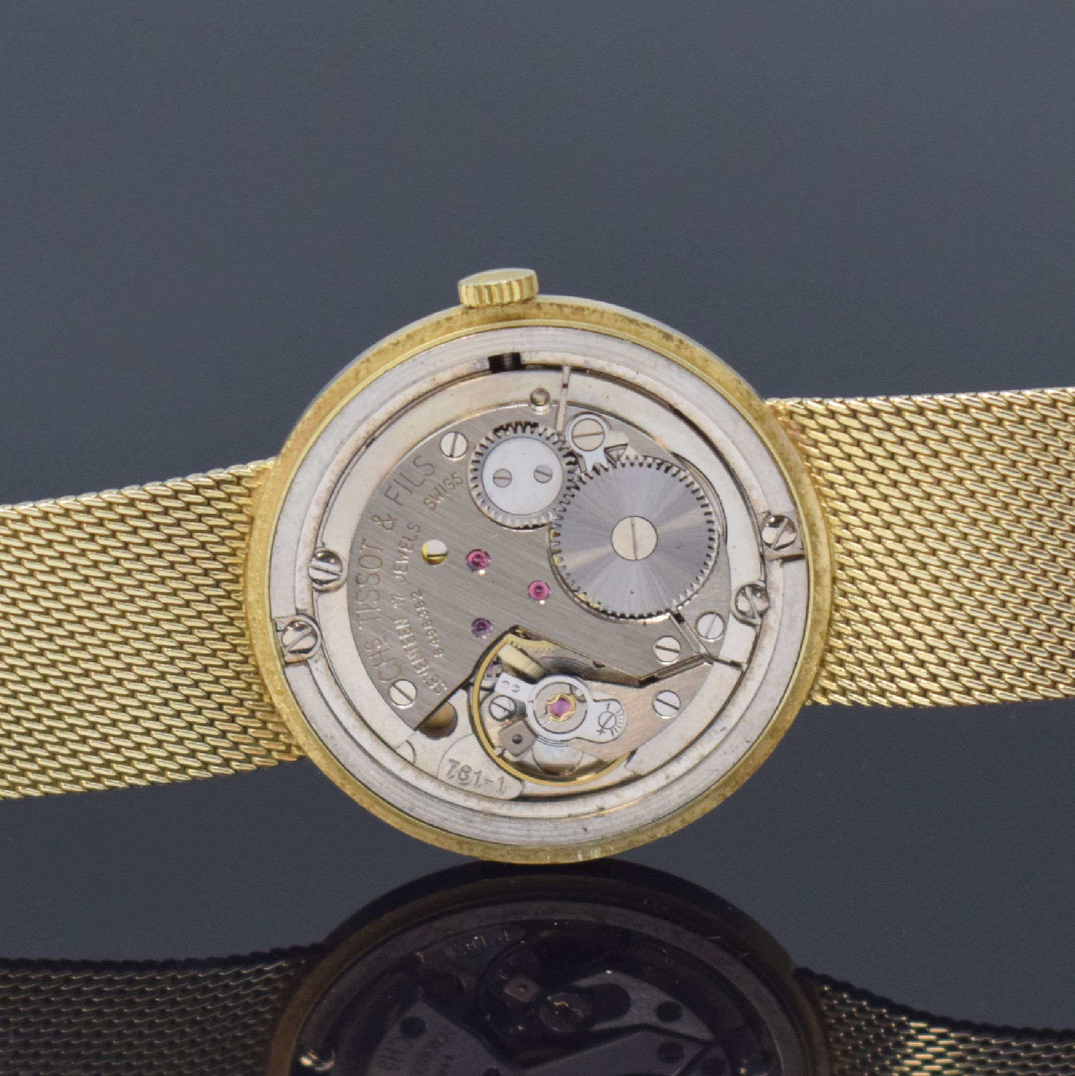 Detail f: TISSOT Herrenarmbanduhr in GG 585/000, Schweiz um 1970, Handaufzug, 2-teil. Gehäuse, Boden aufgedr., Milanaiseband, silb. Zifferbl. m. aufges. ...