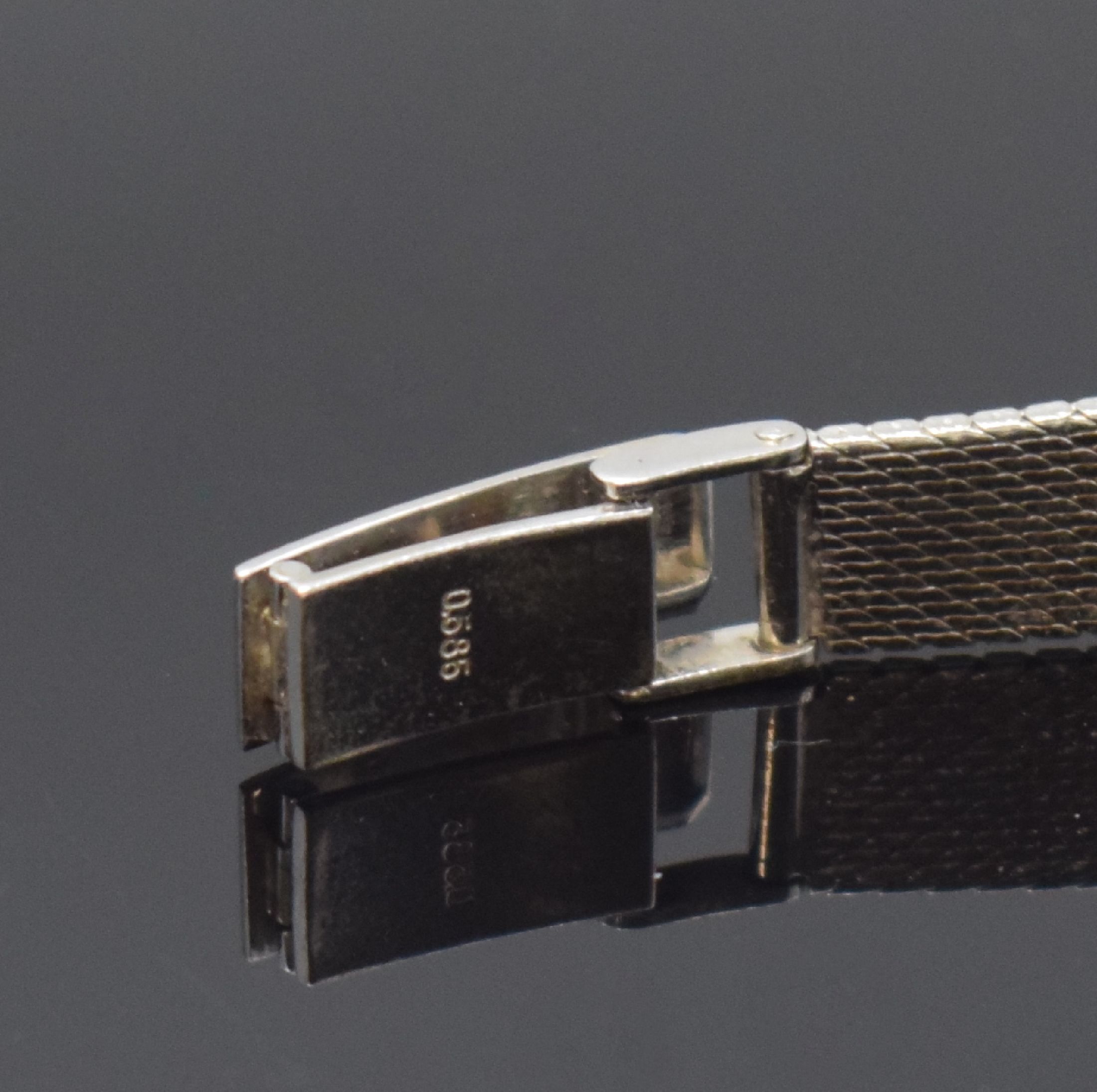 Detail b: Damenarmbanduhr in WG 585/000, Schweiz um 1965, Handaufzug, 2-teil. Gehäuse, Boden aufgedr., silb. Zifferbl. m. aufges. Std.- Ind., rotverg. Werk ...