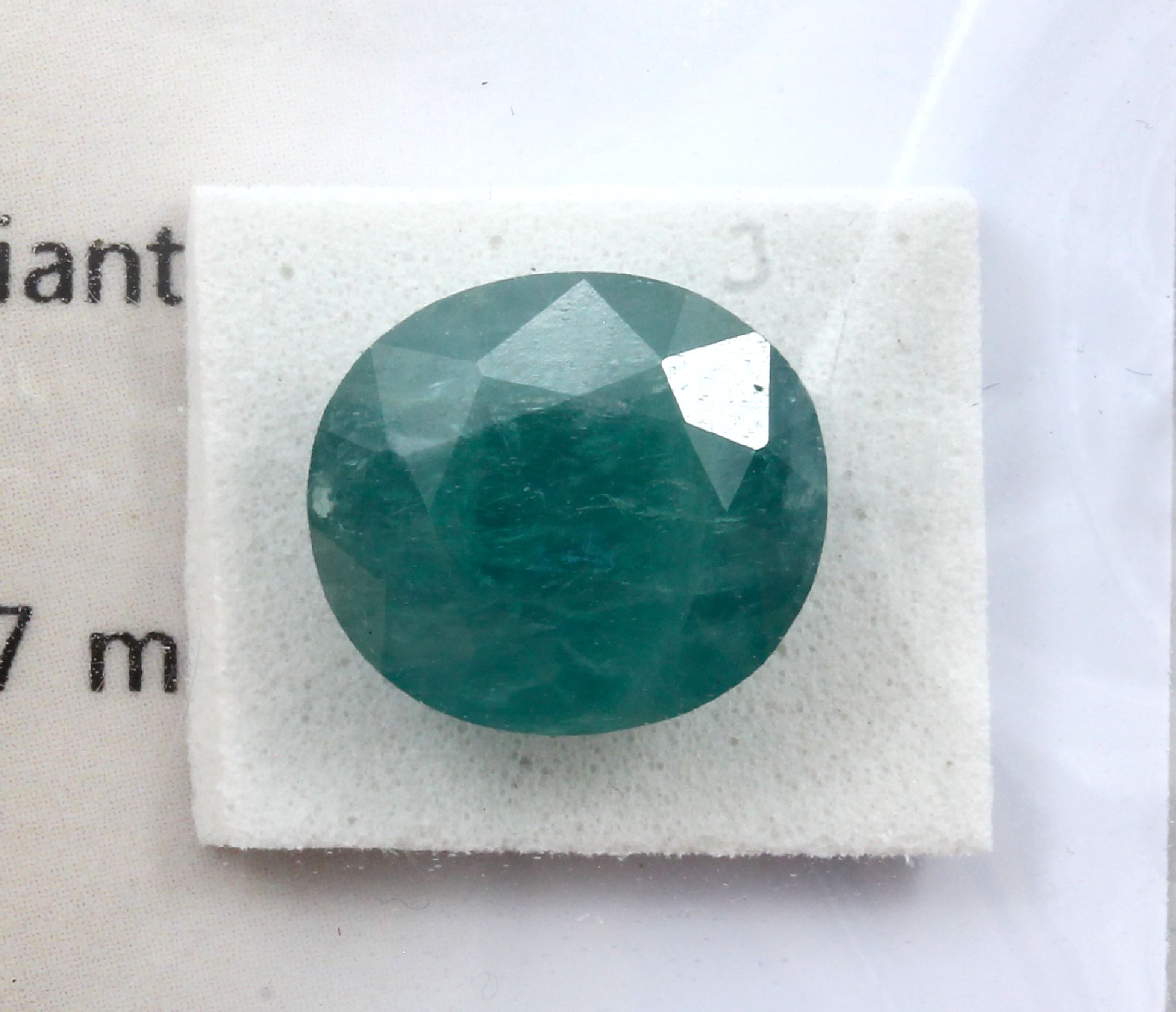 Detail a: Loser nat. Grandidierite 6.83 ct, oval facett. modifizierter Brillantschliff, bluish Green, ca. 12.29 x 10.93 x 7.97 mm, GCI Blister 10/23