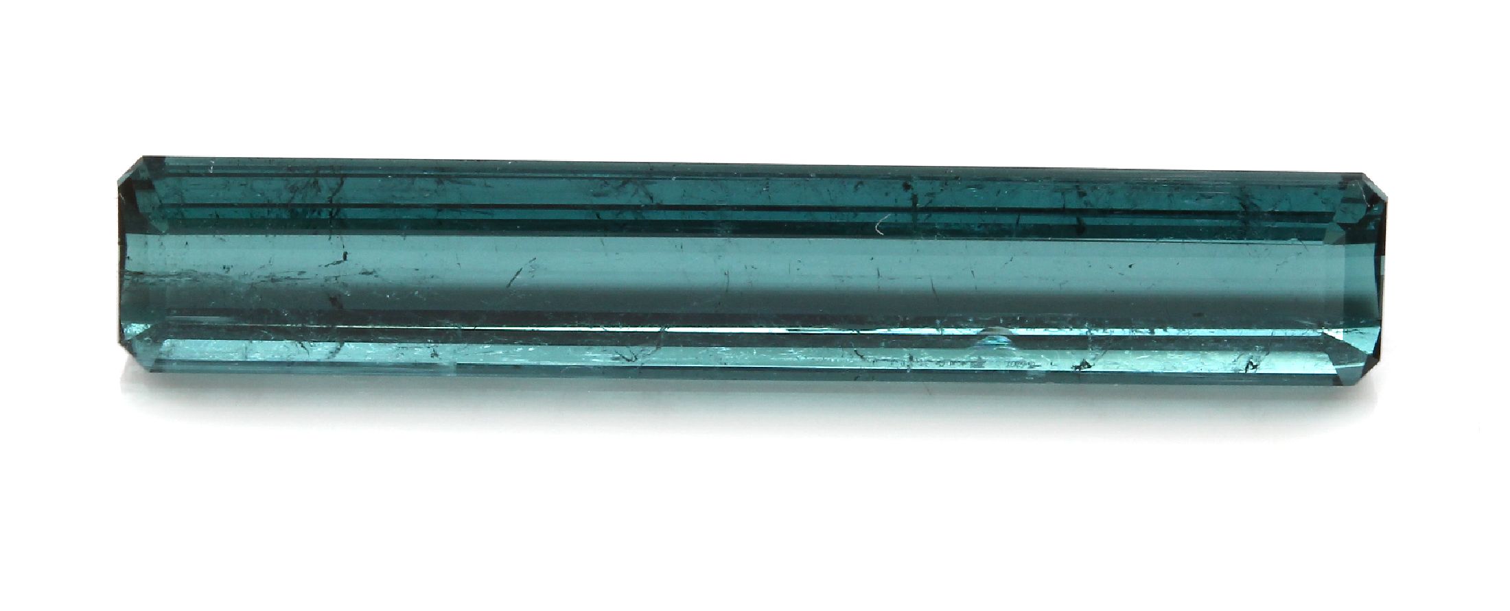 Loser Turmalin ca. 9.4 ct, petrolfarben im Rechteckschliff ca. 32.8 x 5.7 x 4.5 mm